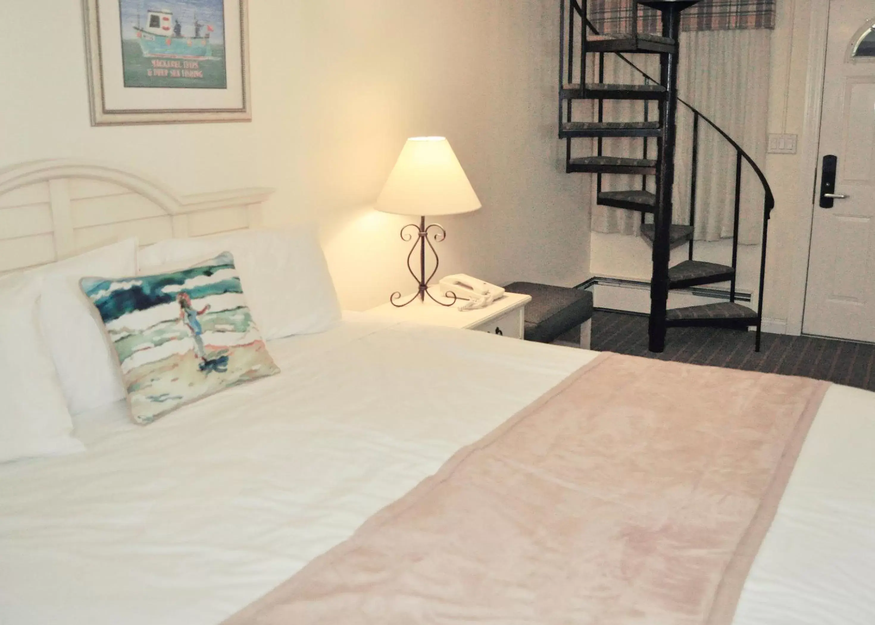 Bed in Cape Winds Resort, a VRI resort