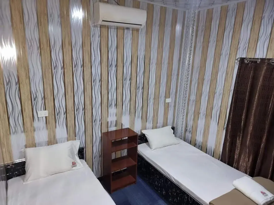 Bed in Al - Minhaj Service Apartments