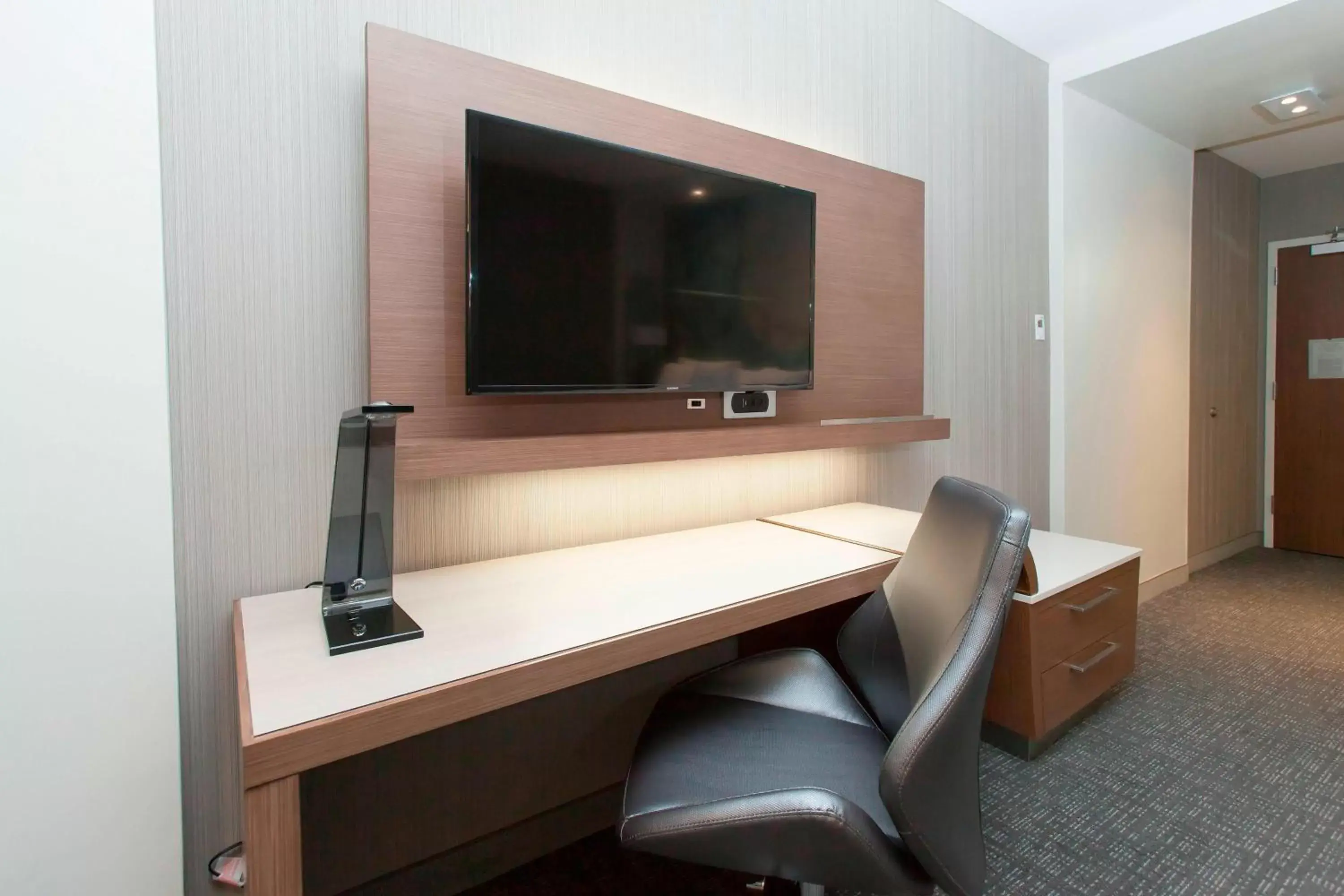 Photo of the whole room, TV/Entertainment Center in Courtyard by Marriott Houston Springwoods Village