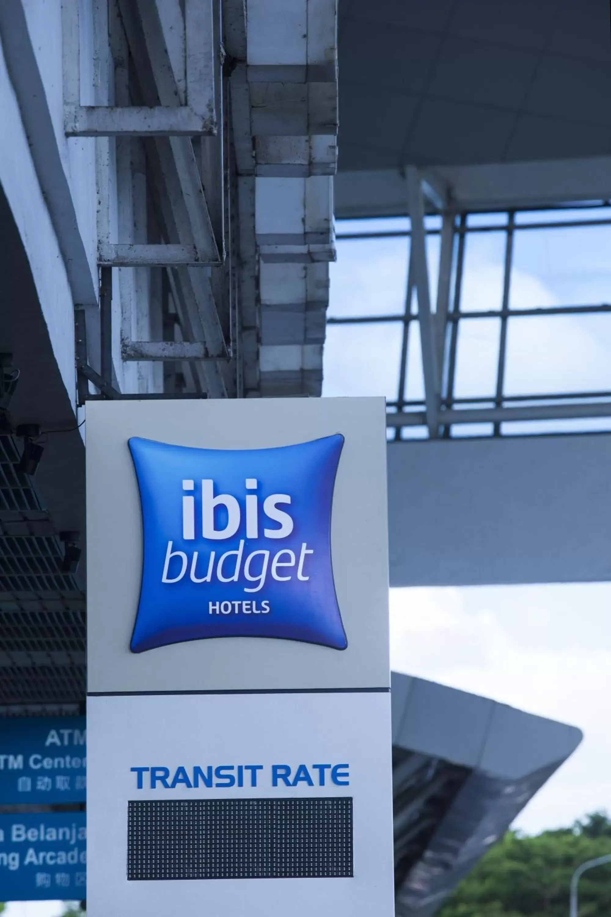 Property logo or sign in Ibis Budget Makassar Airport