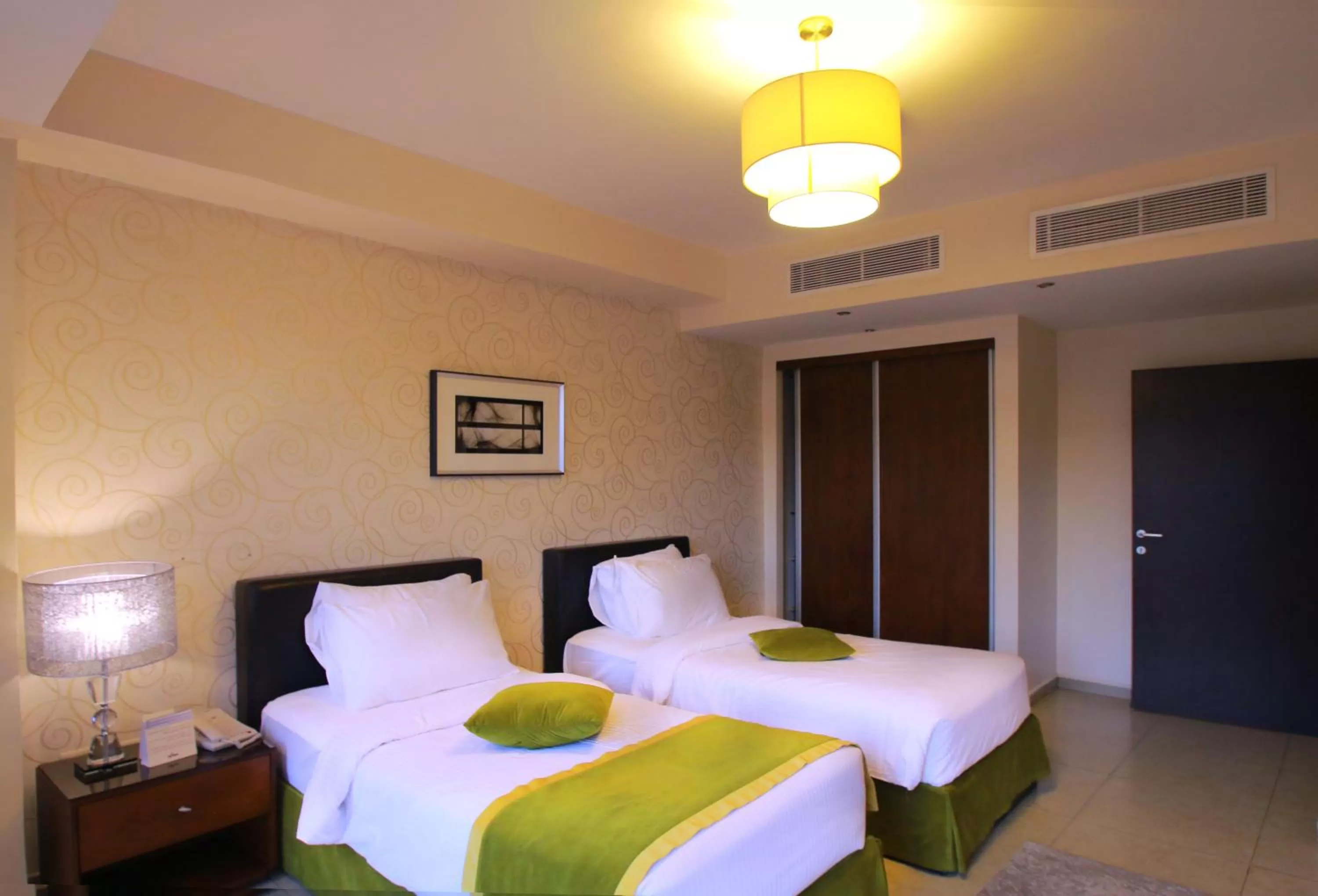 Bed in City Rose Hotel Suites