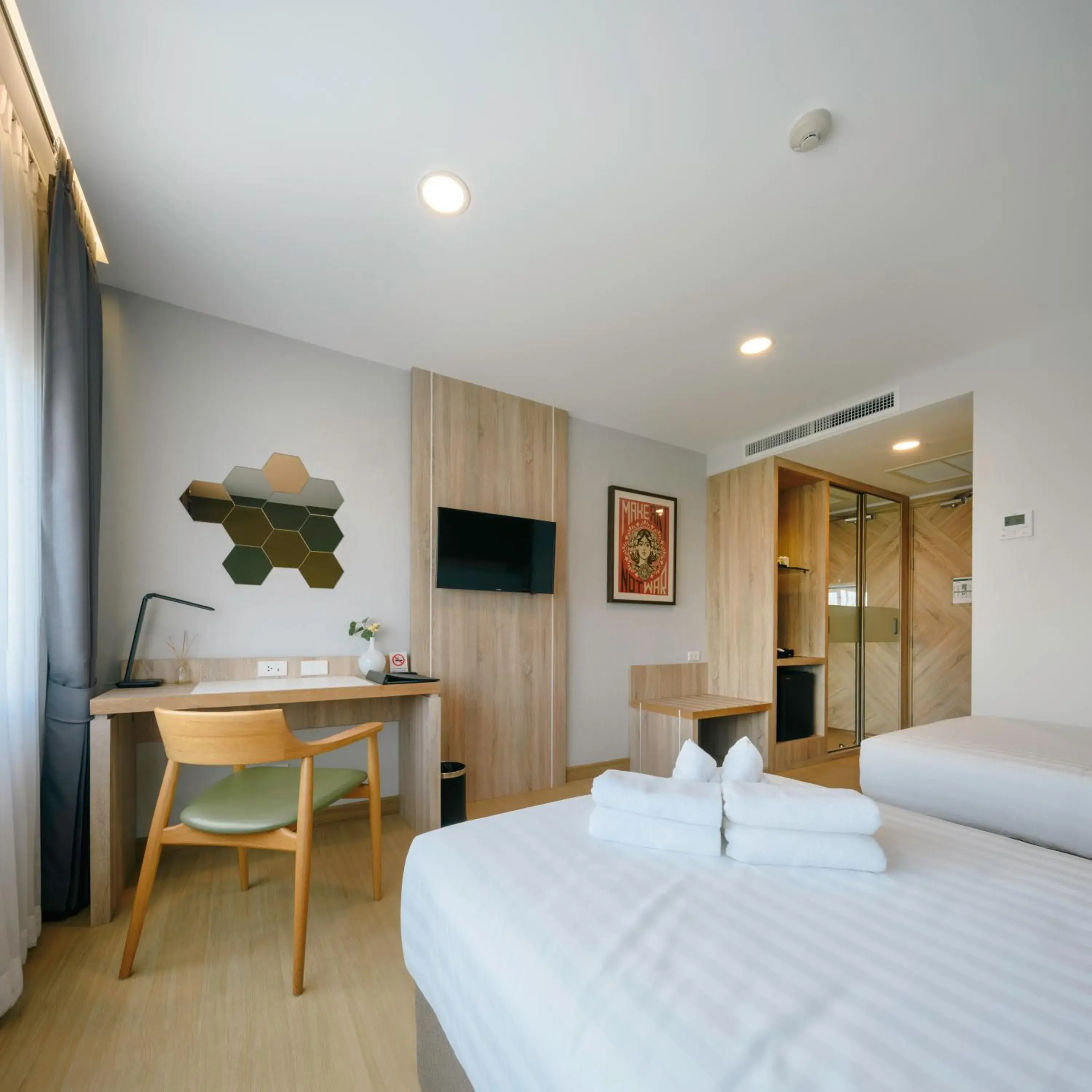 Bedroom, TV/Entertainment Center in Prime Square Hotel