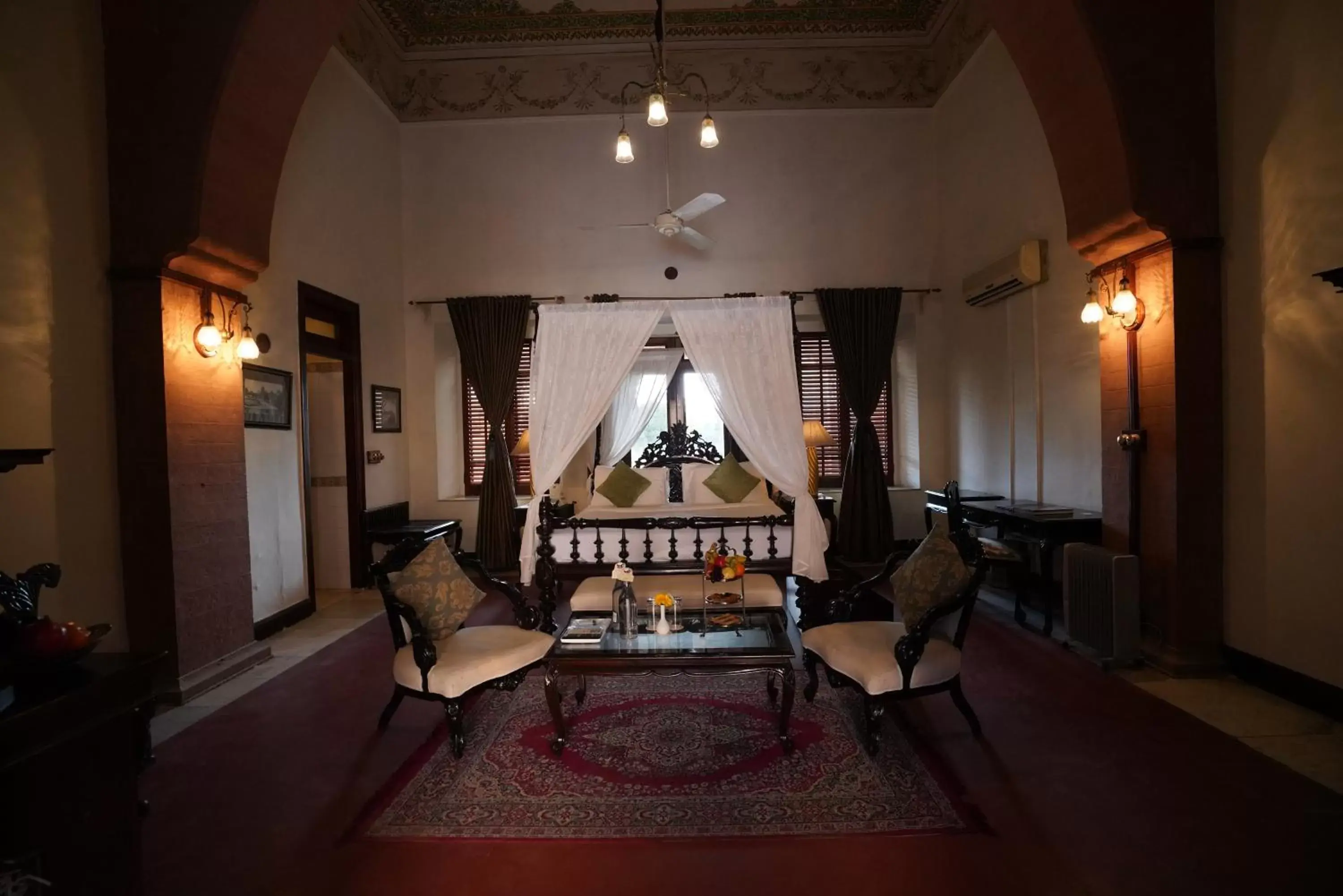 Bed, Seating Area in The Laxmi Niwas Palace