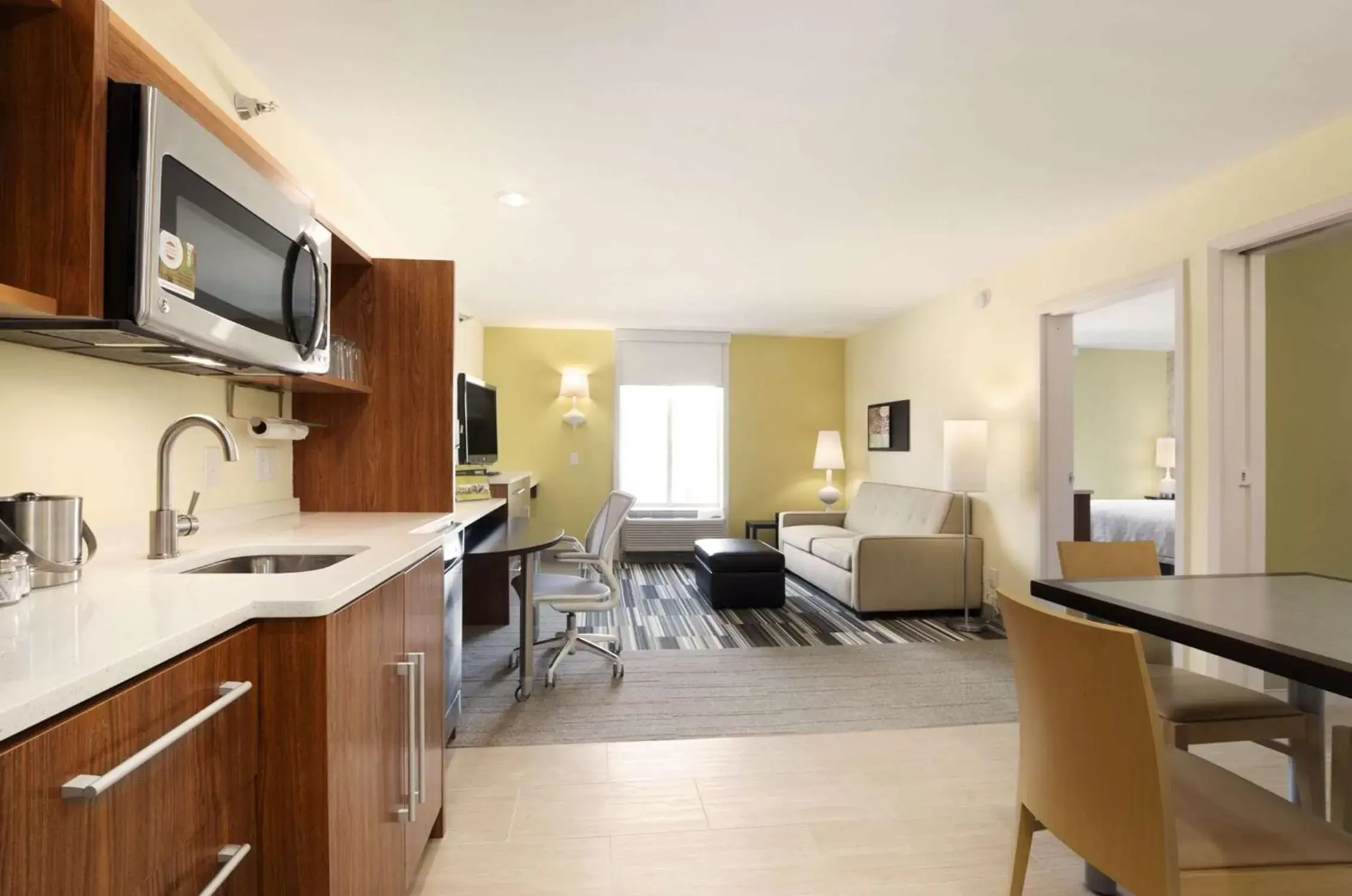 Living room, Kitchen/Kitchenette in Home2 Suites by Hilton Biloxi/North/D'Iberville