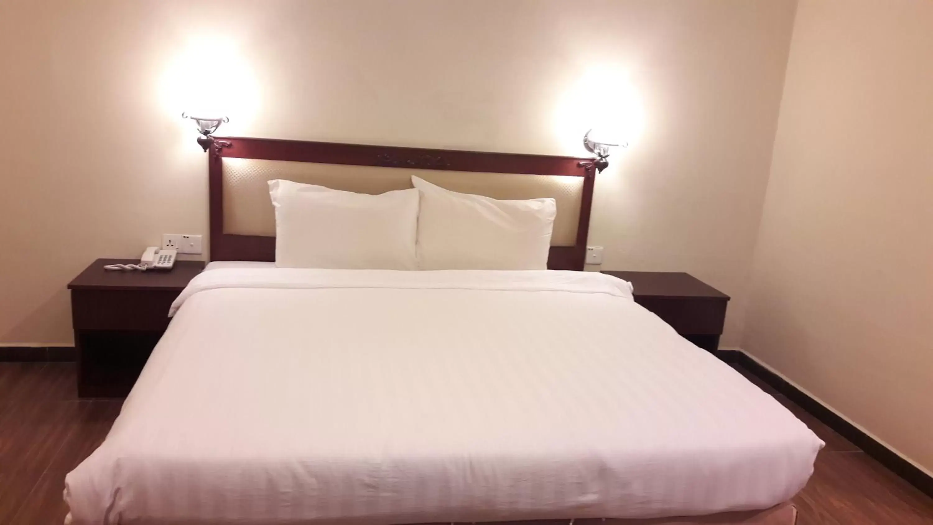 Bed in Cheng Ho Hotel