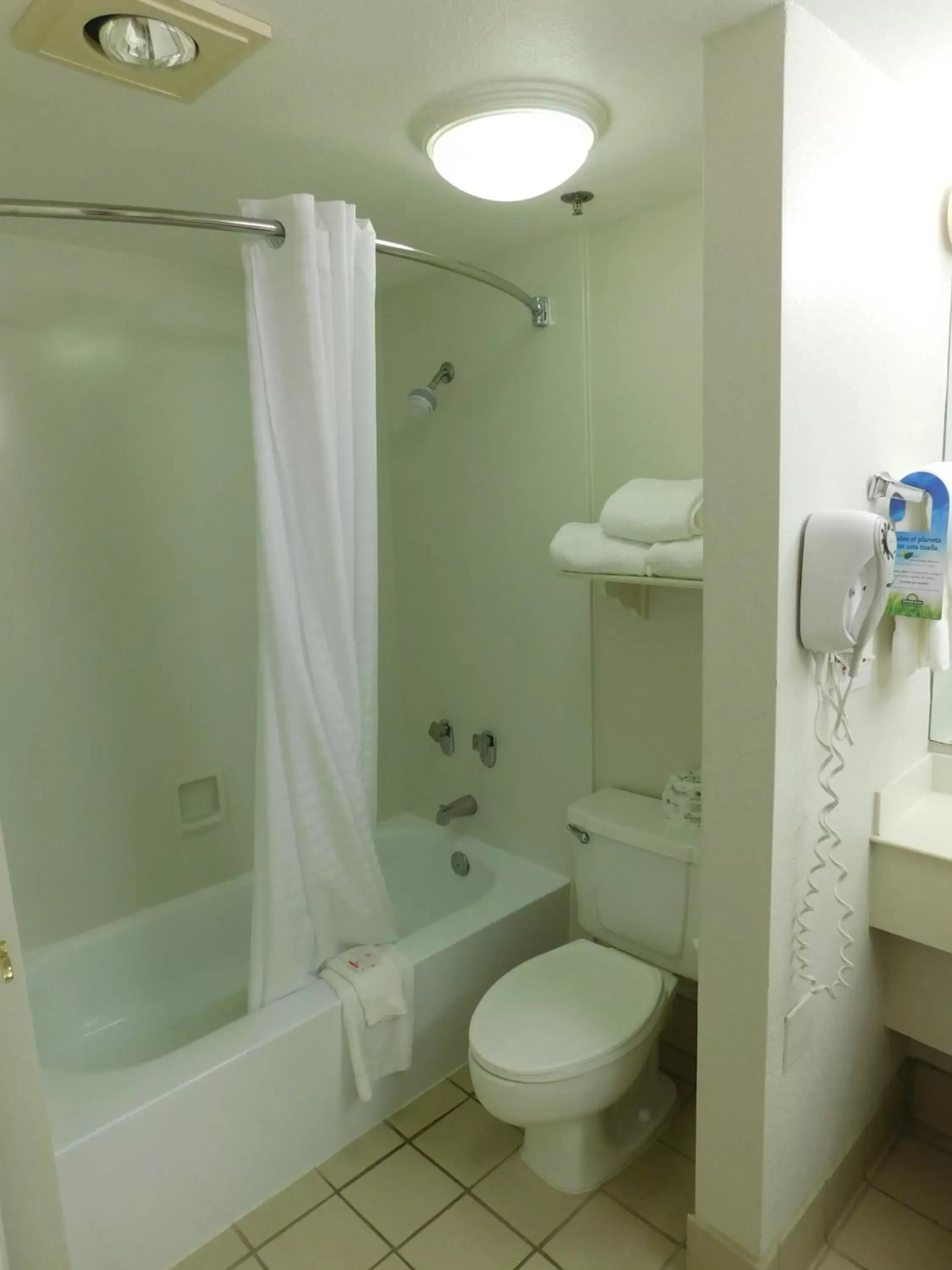 Bathroom in Days Inn & Suites by Wyndham Arlington Heights