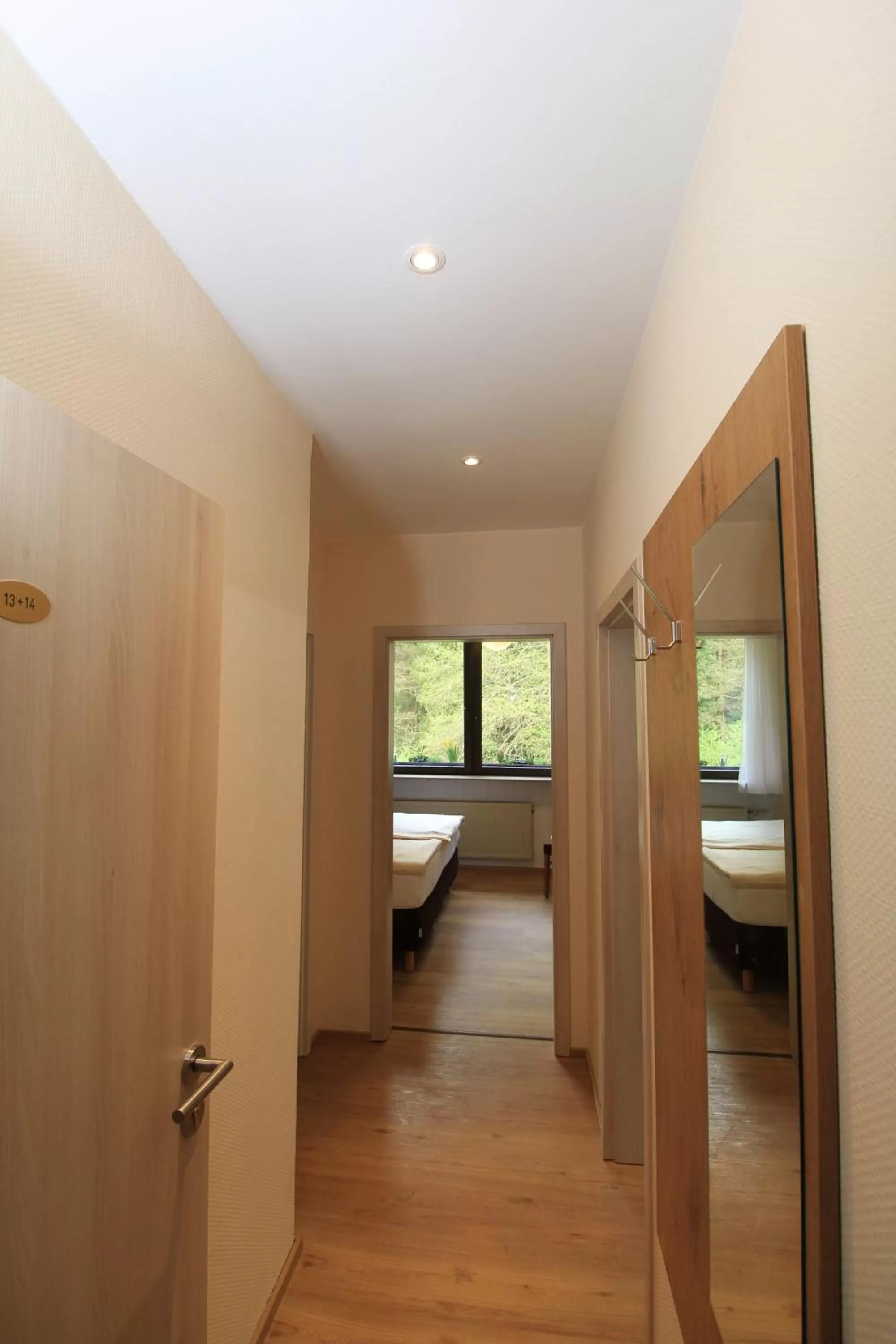 Bed in Waldhotel Albachmühle mit Albacher Stuben