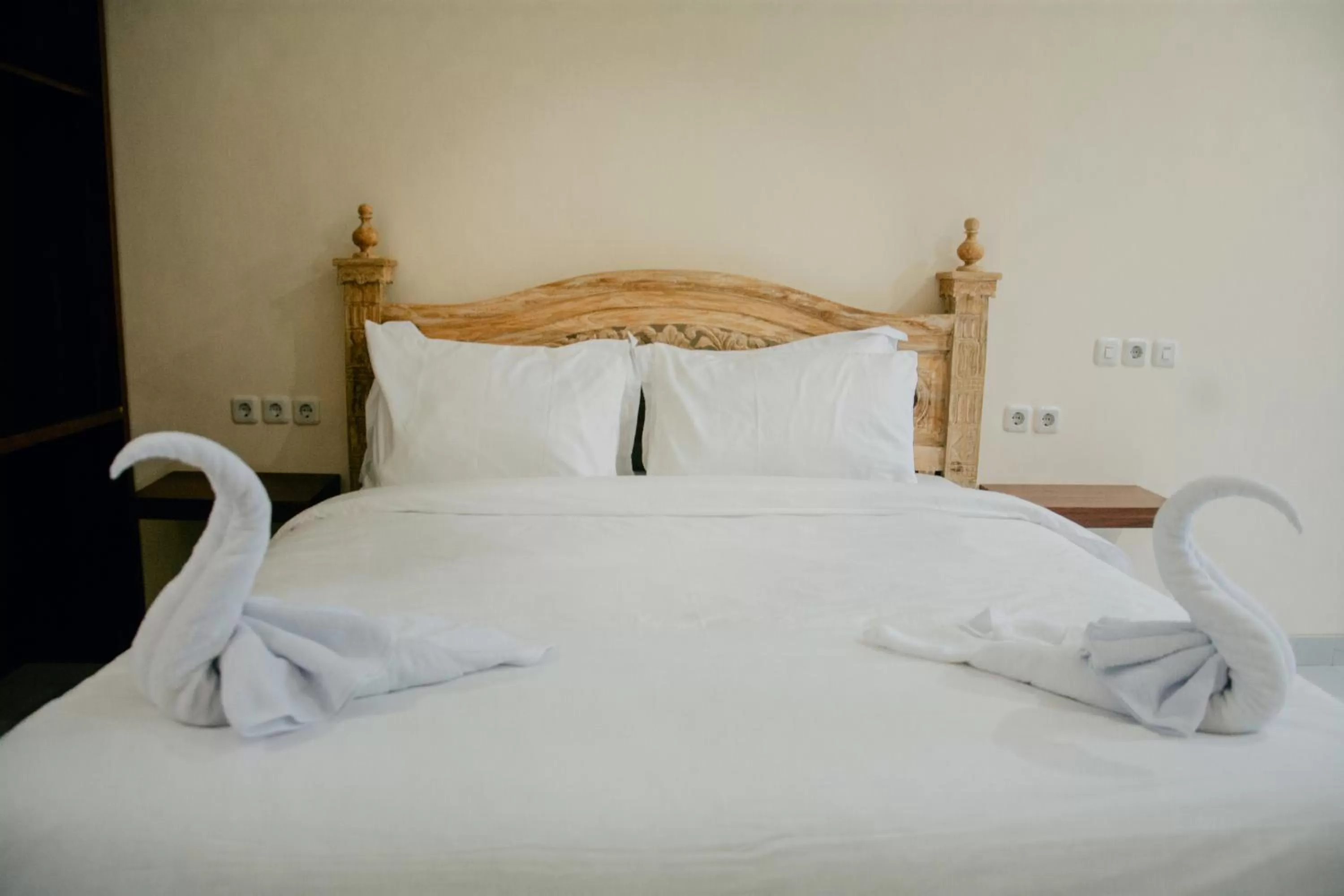 Bed in THE LAVIANA HOTEL