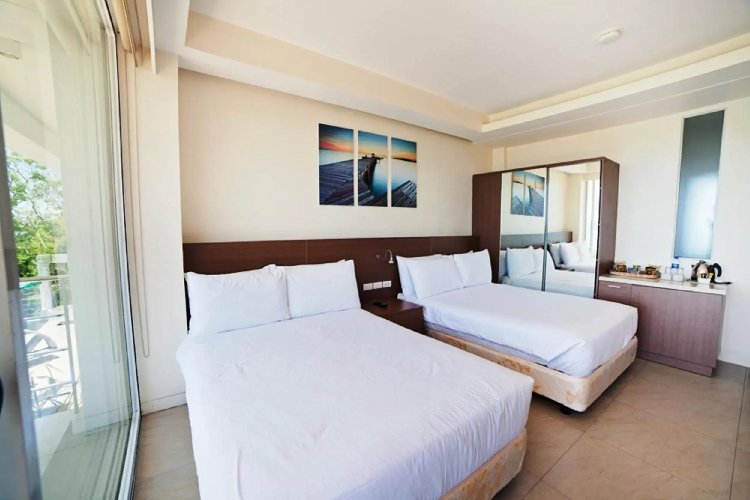 Photo of the whole room, Bed in Ocean Suites Bohol Boutique Hotel
