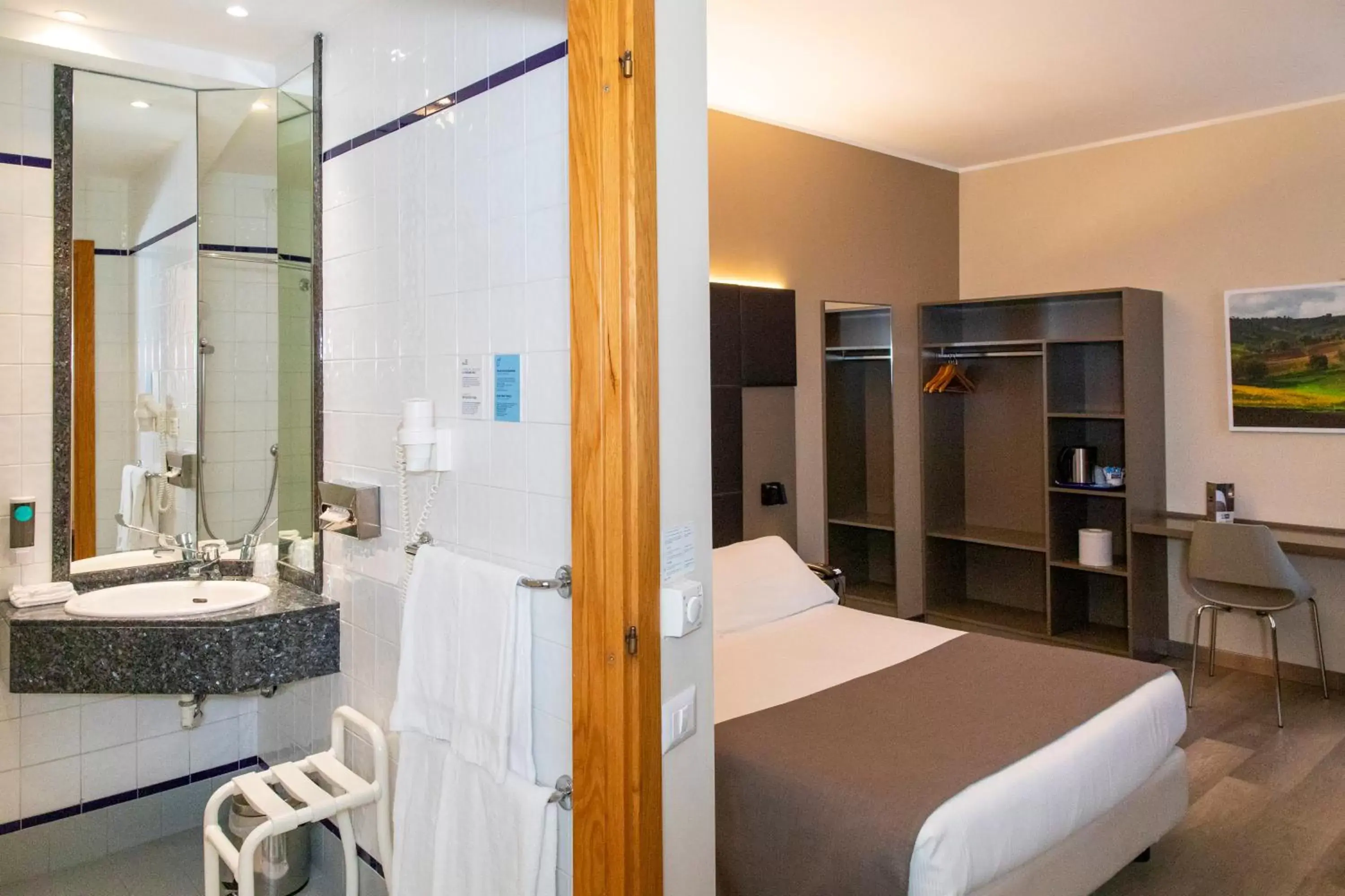 Bed, Bathroom in City Hotel & Suites