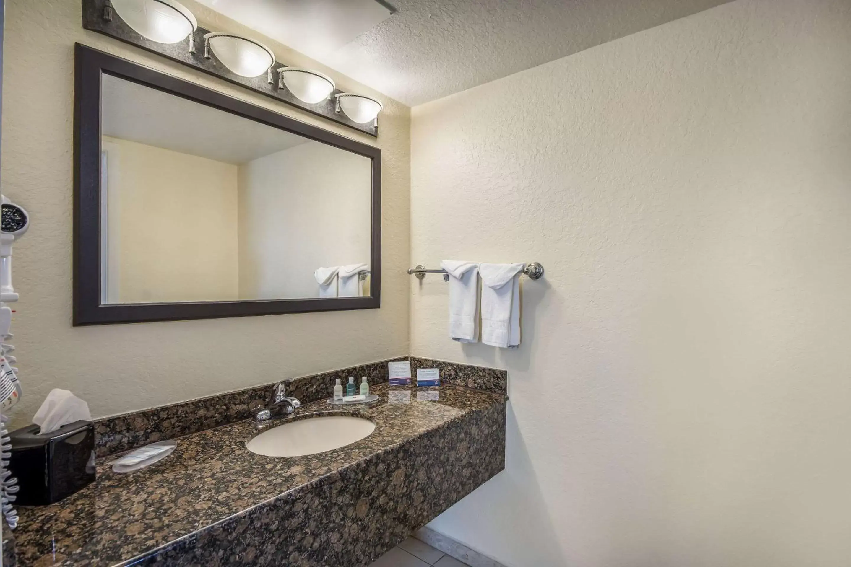 Bathroom in Clarion Inn & Suites Central Clearwater Beach