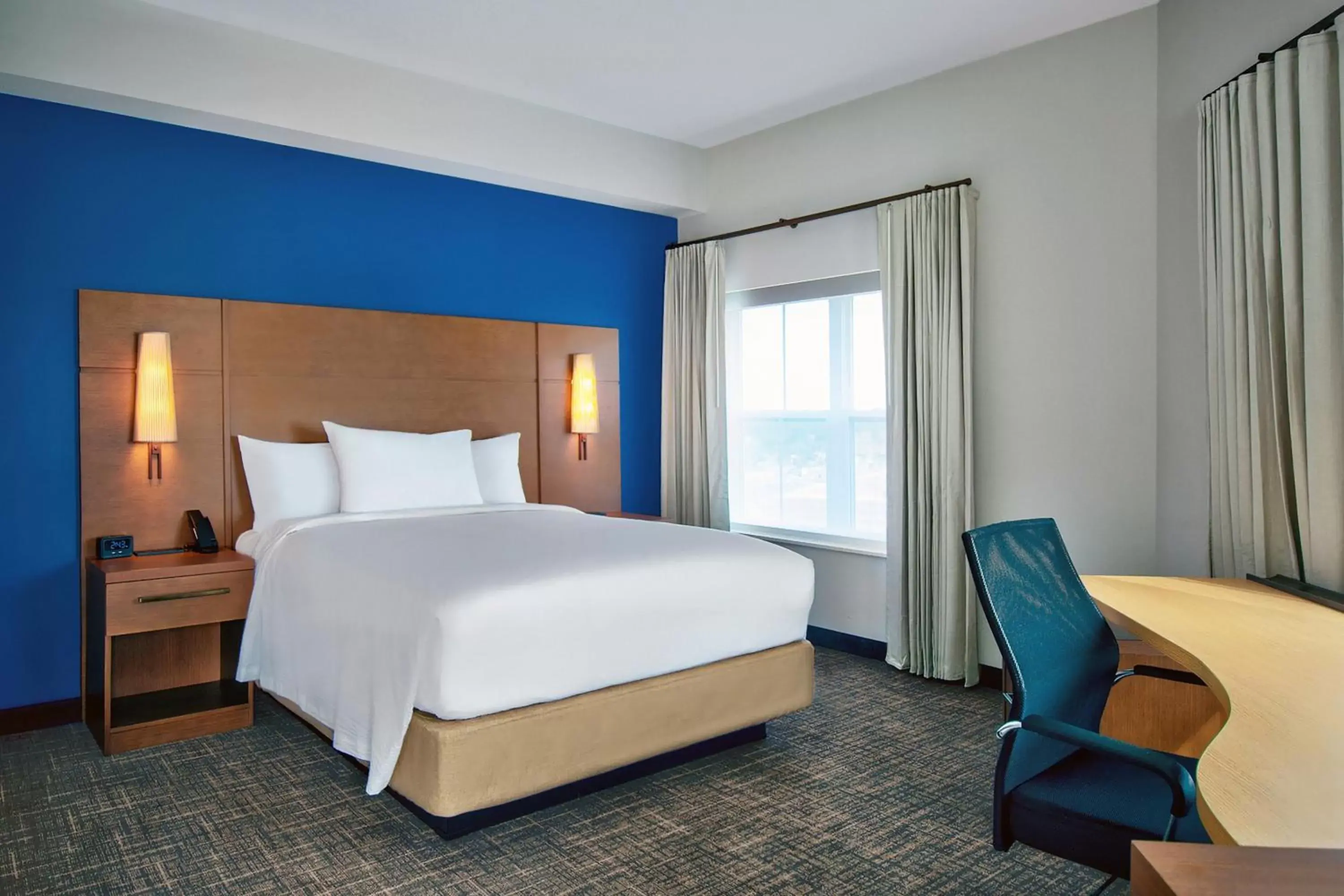 Photo of the whole room, Bed in Residence Inn by Marriott Orlando at FLAMINGO CROSSINGS Town Center