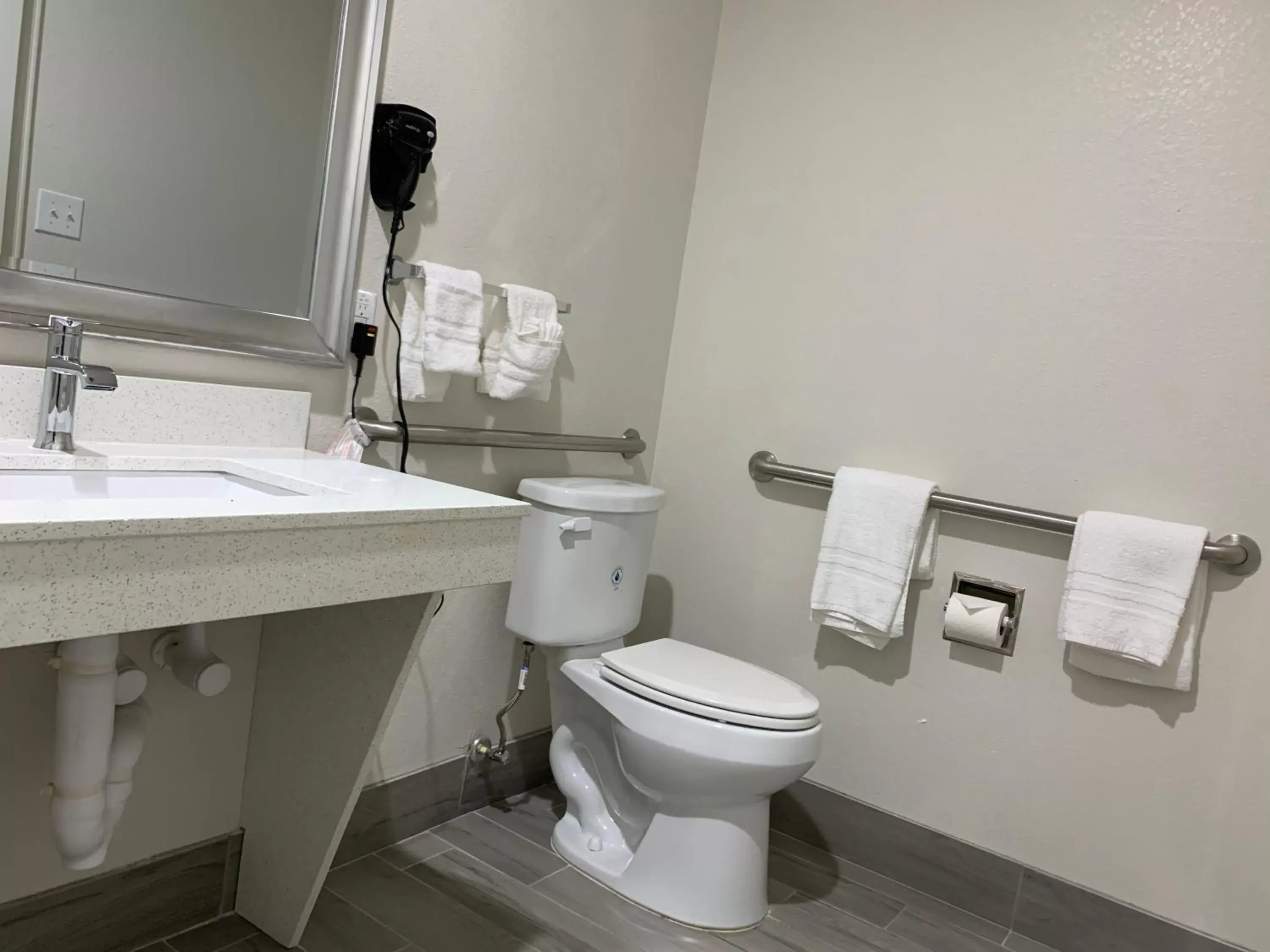 Bathroom in Scottish Inn & Suites - IAH Airport