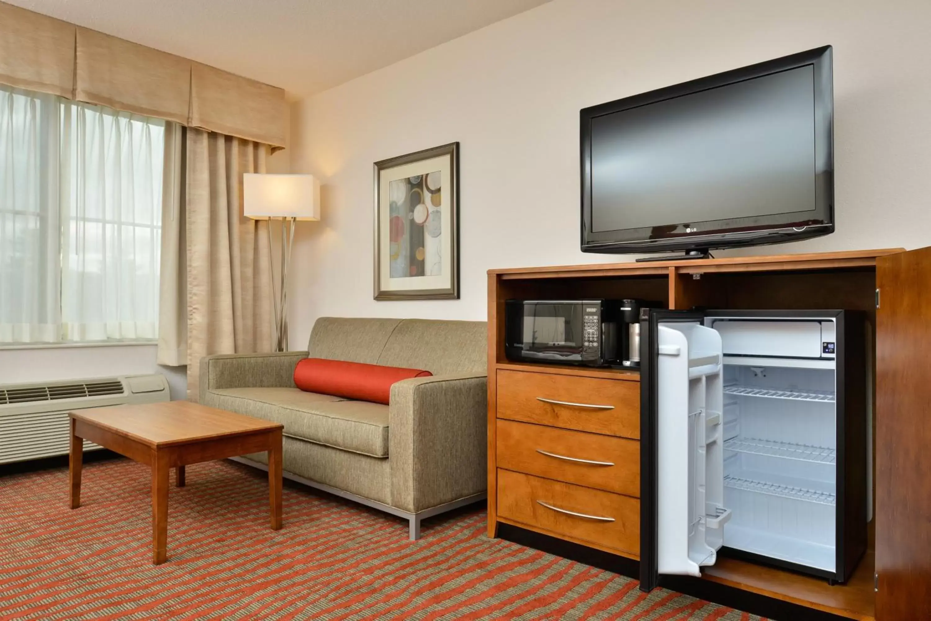 Photo of the whole room, TV/Entertainment Center in Holiday Inn Express Boston/Milford Hotel, an IHG Hotel