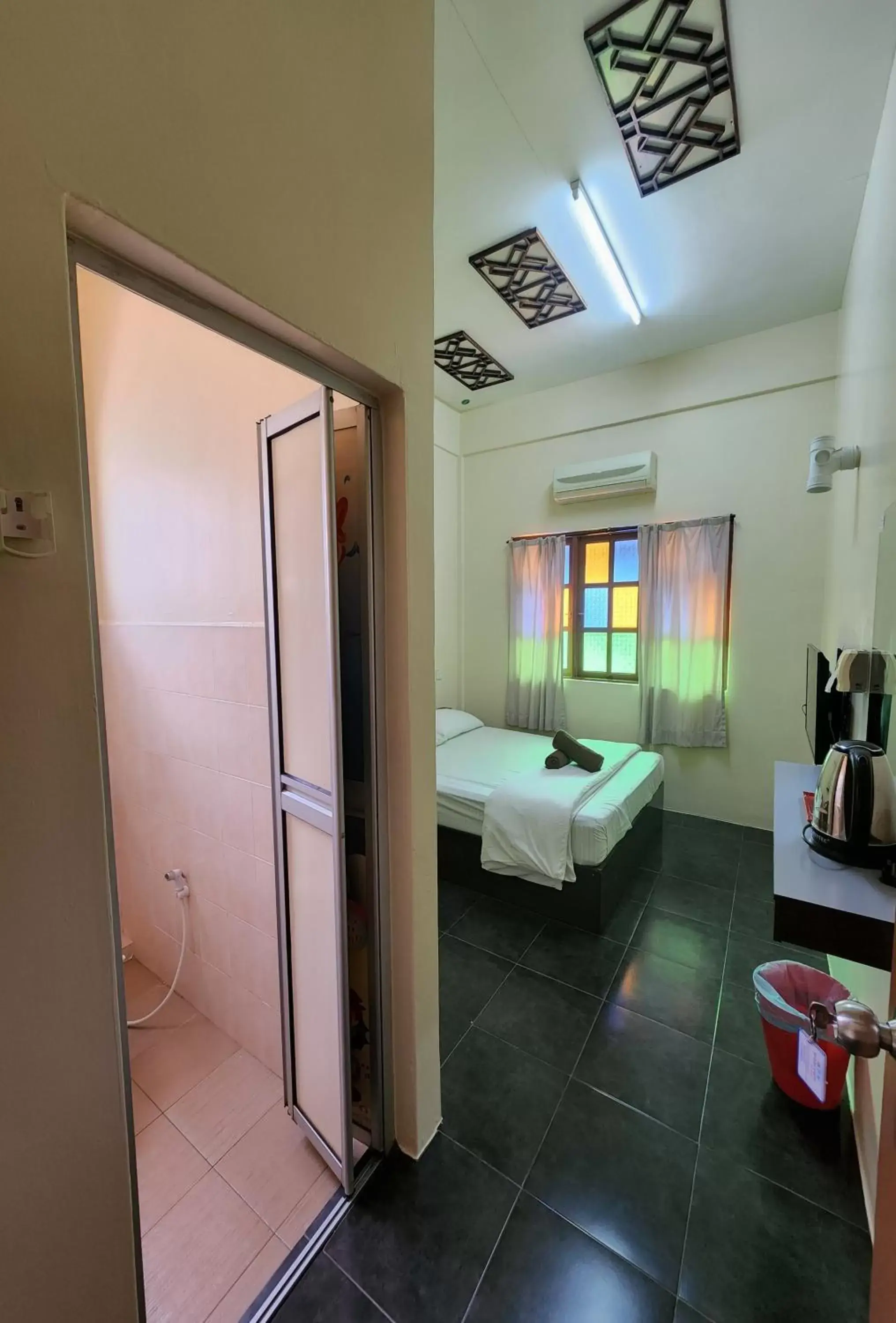 Bed, Bathroom in Sabak Awor Resort