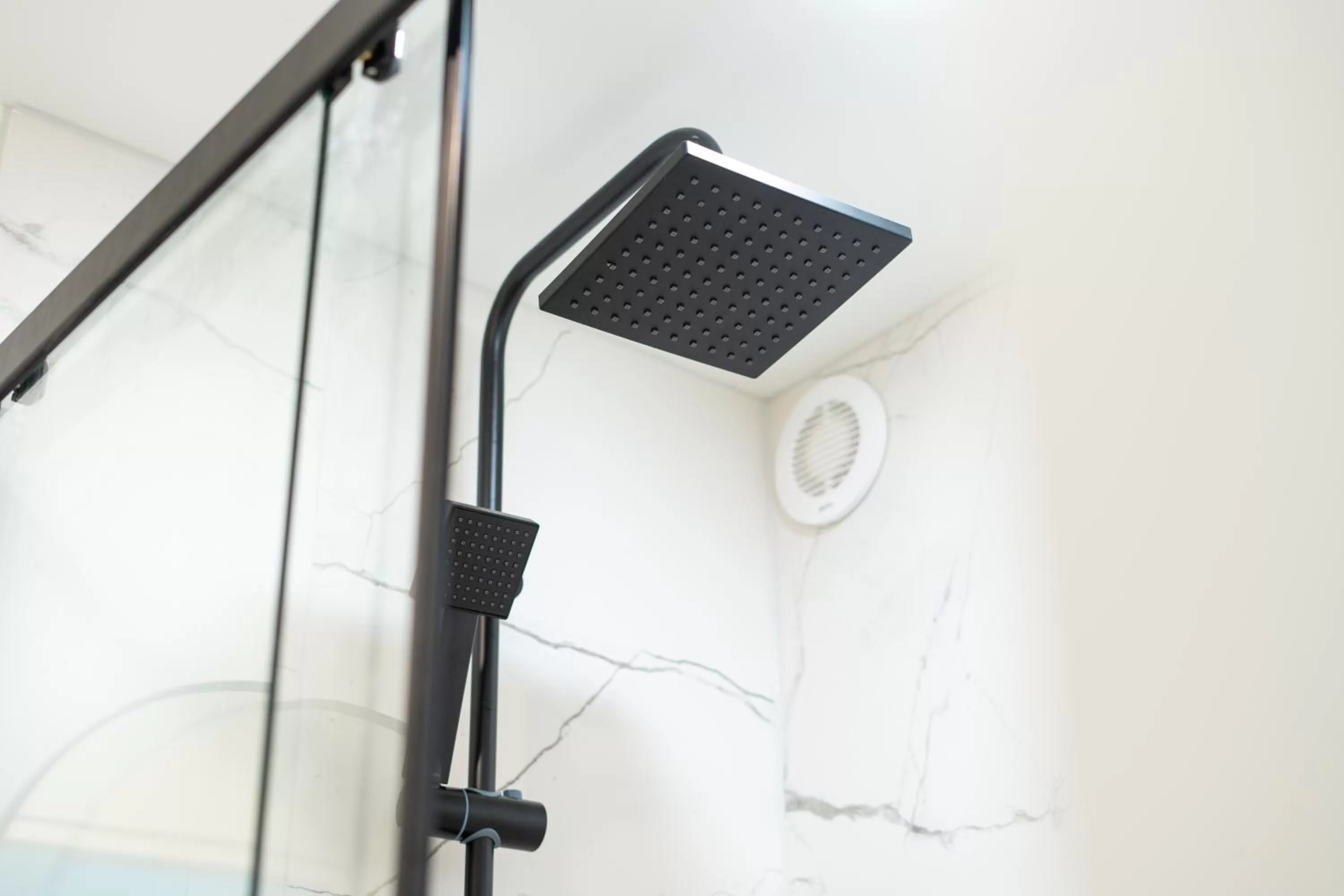 Shower in Oasis Airport Studios by RevalHome