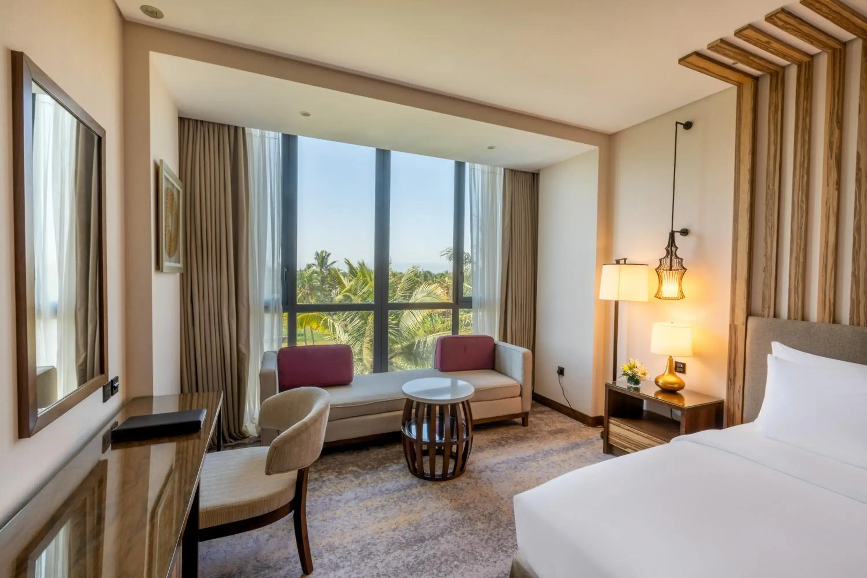 Bedroom, Seating Area in Millennium Resort Salalah