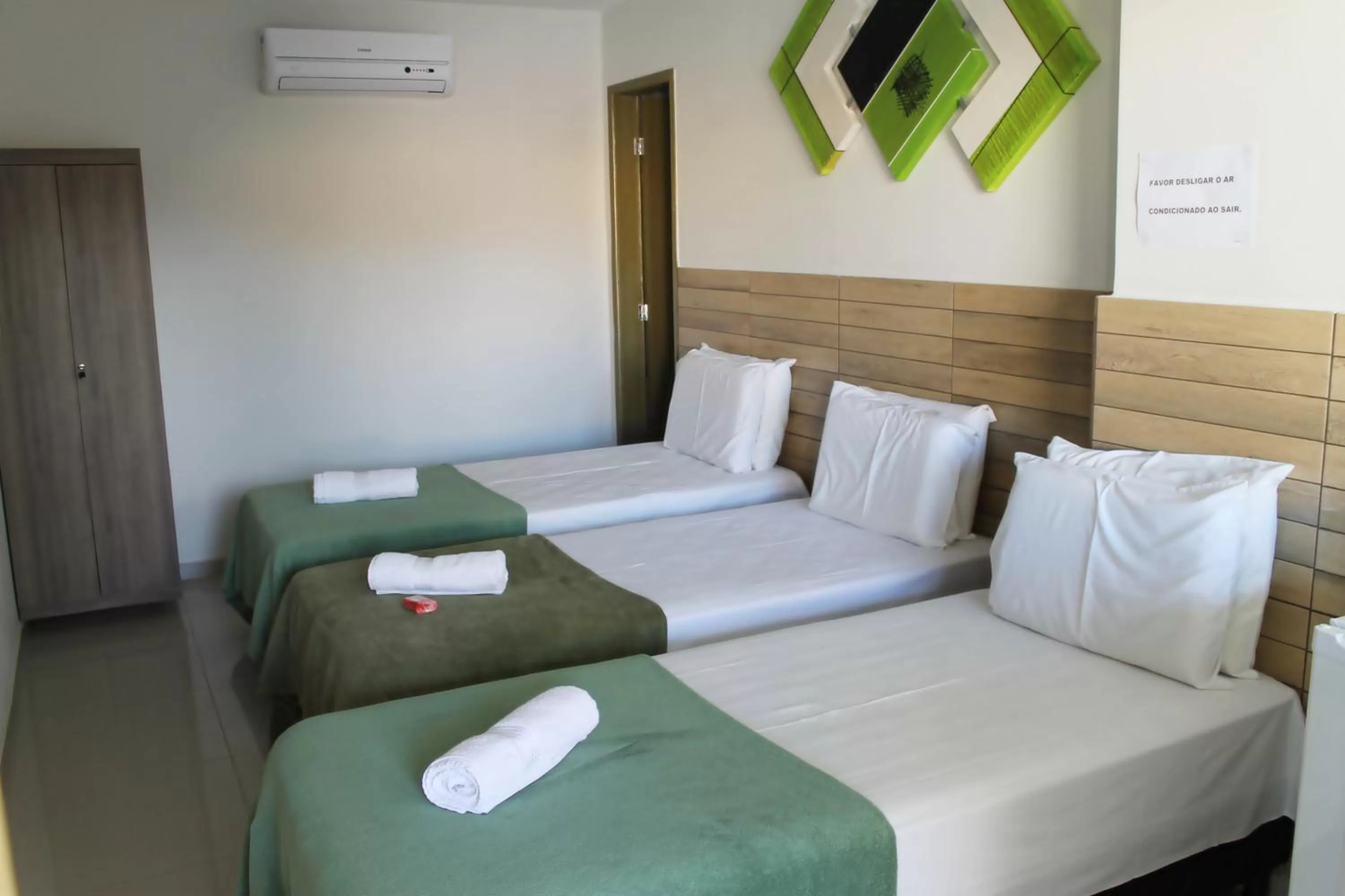 Bed in Pousada Das Palmeiras