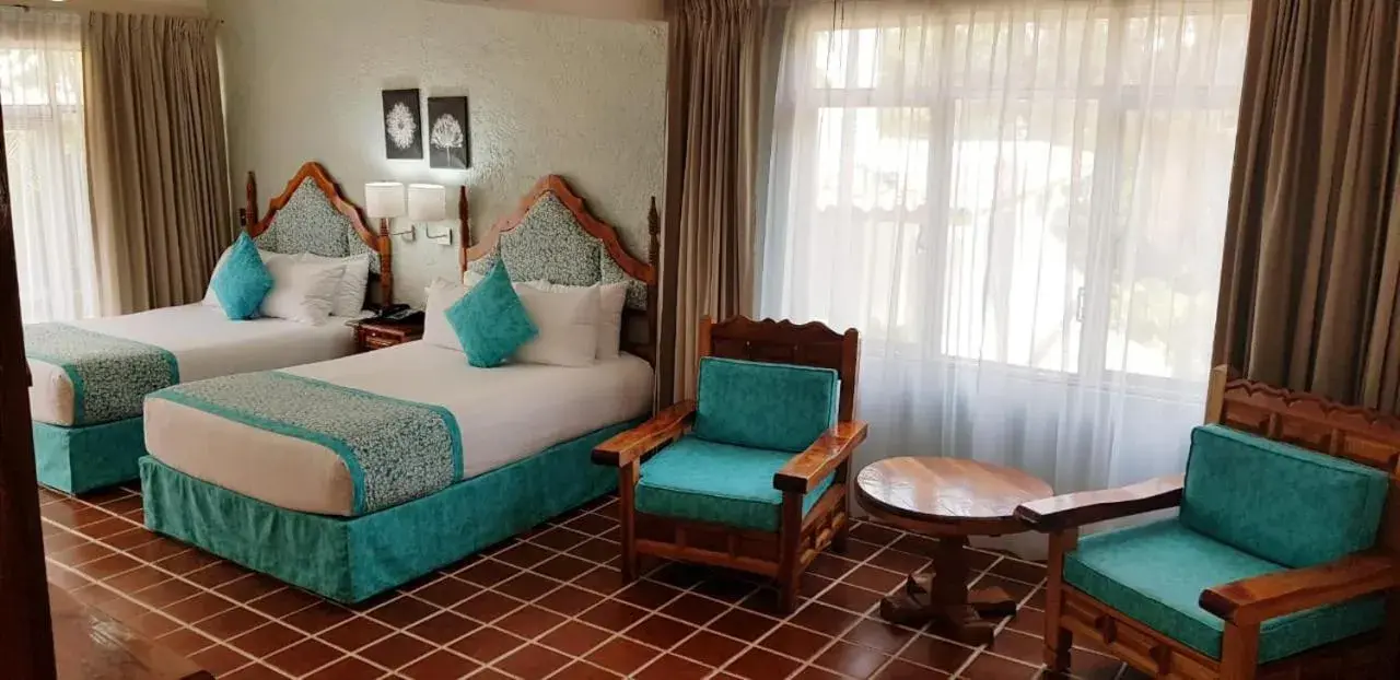 Bed in Hotel Posada Quinta Las Flores
