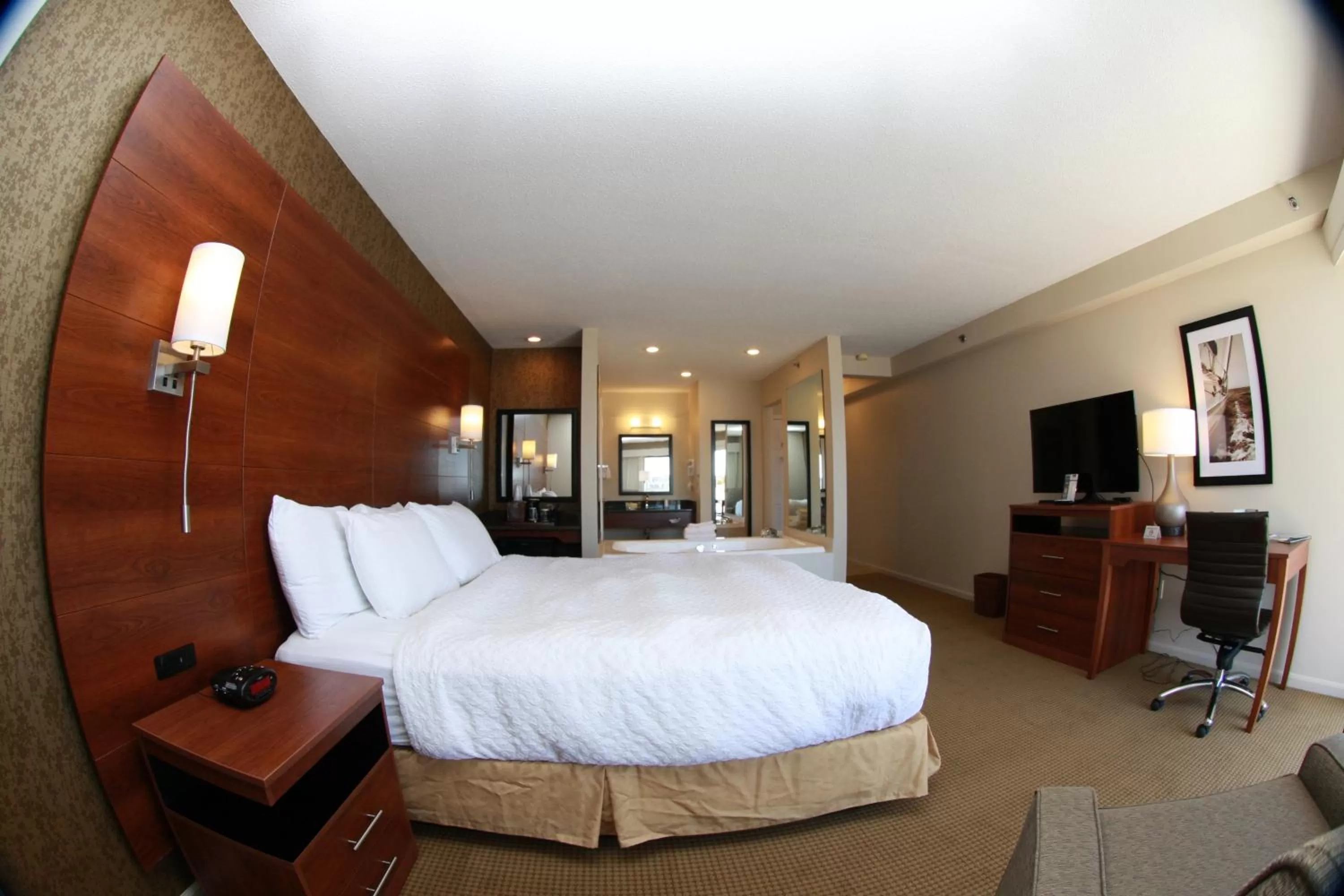 Bed in Budget Host Inn & Suites