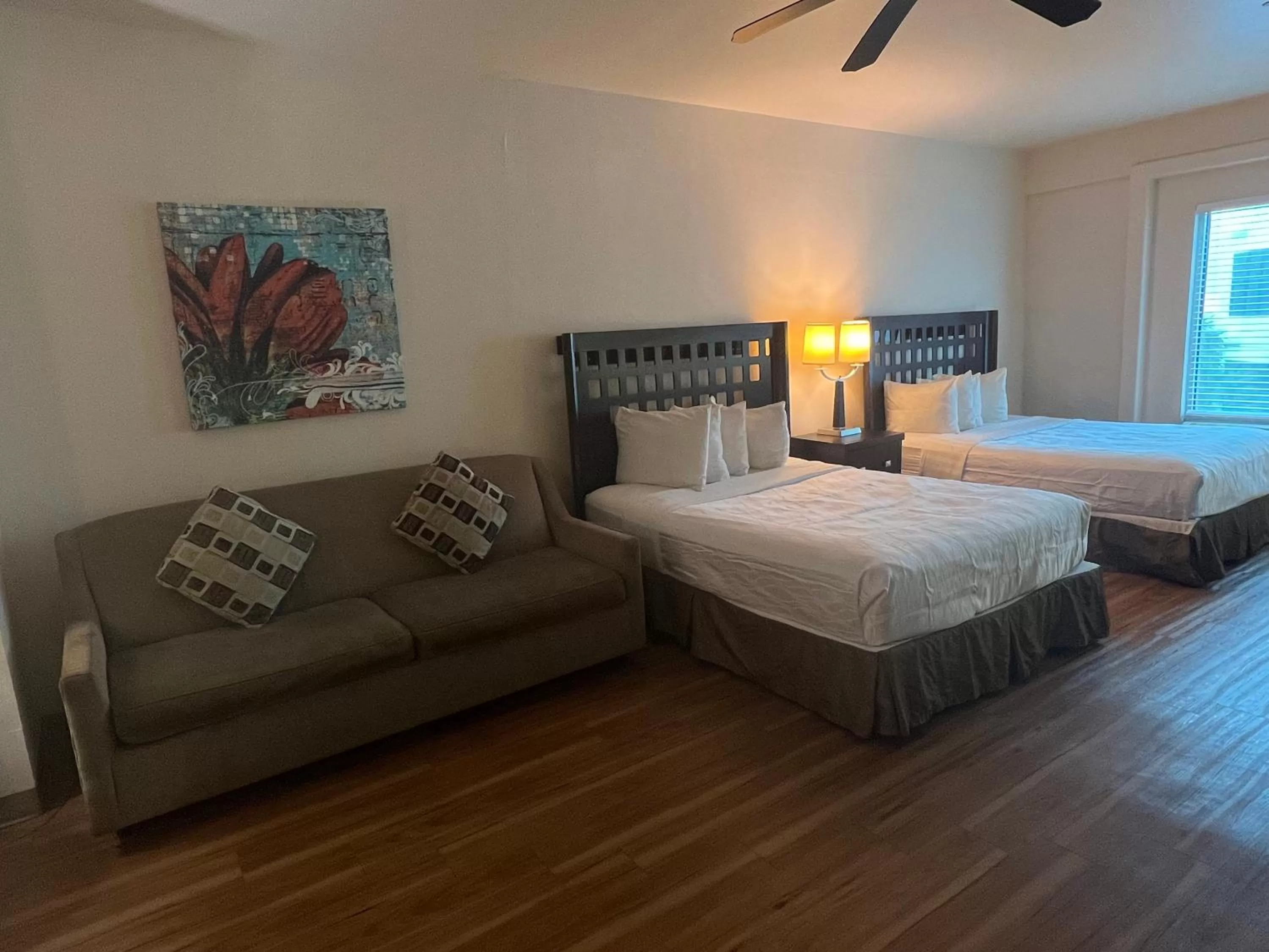 Bed in Sunchase Inn & Suites