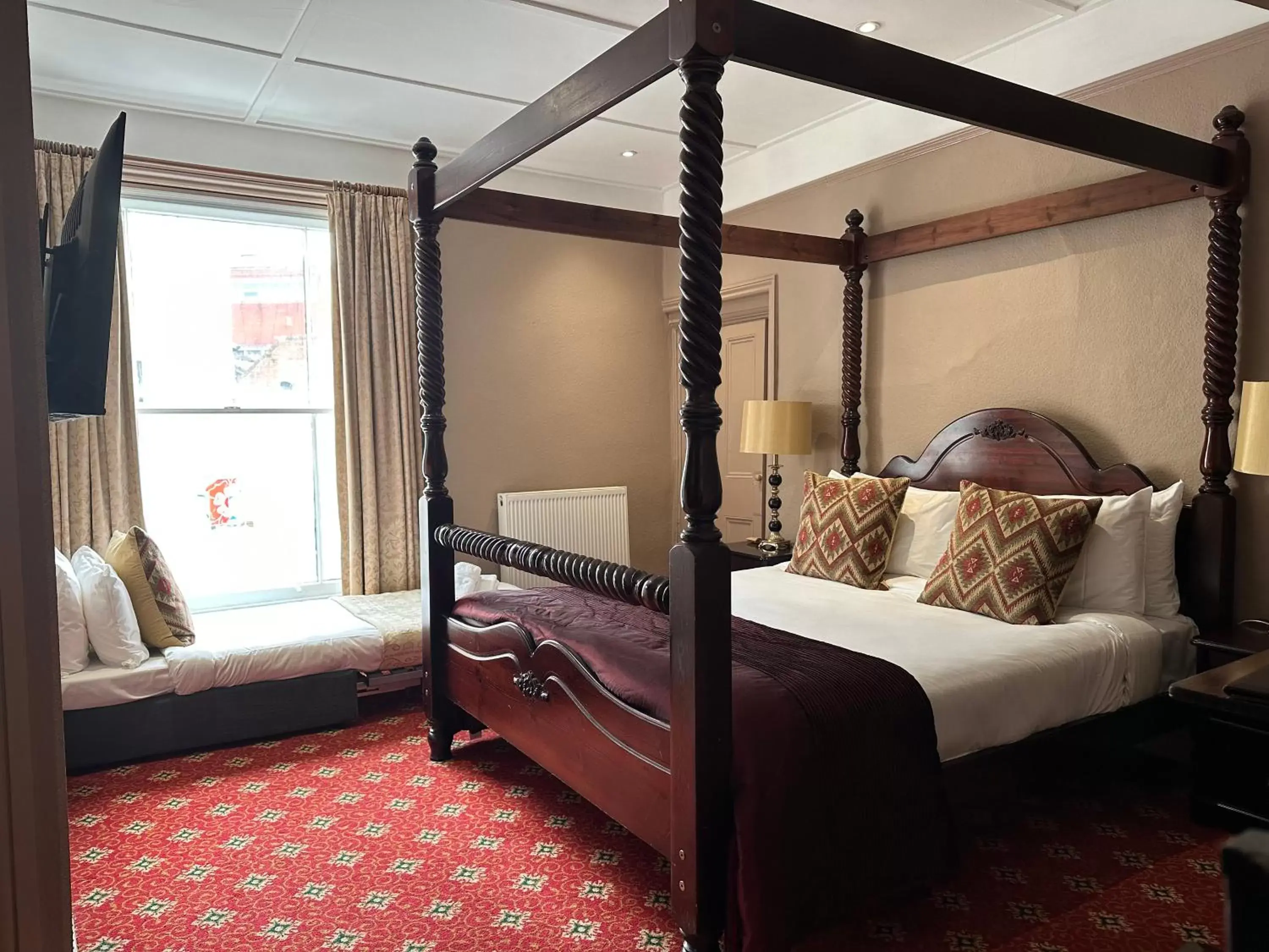 Bed in The Tudor Hotel