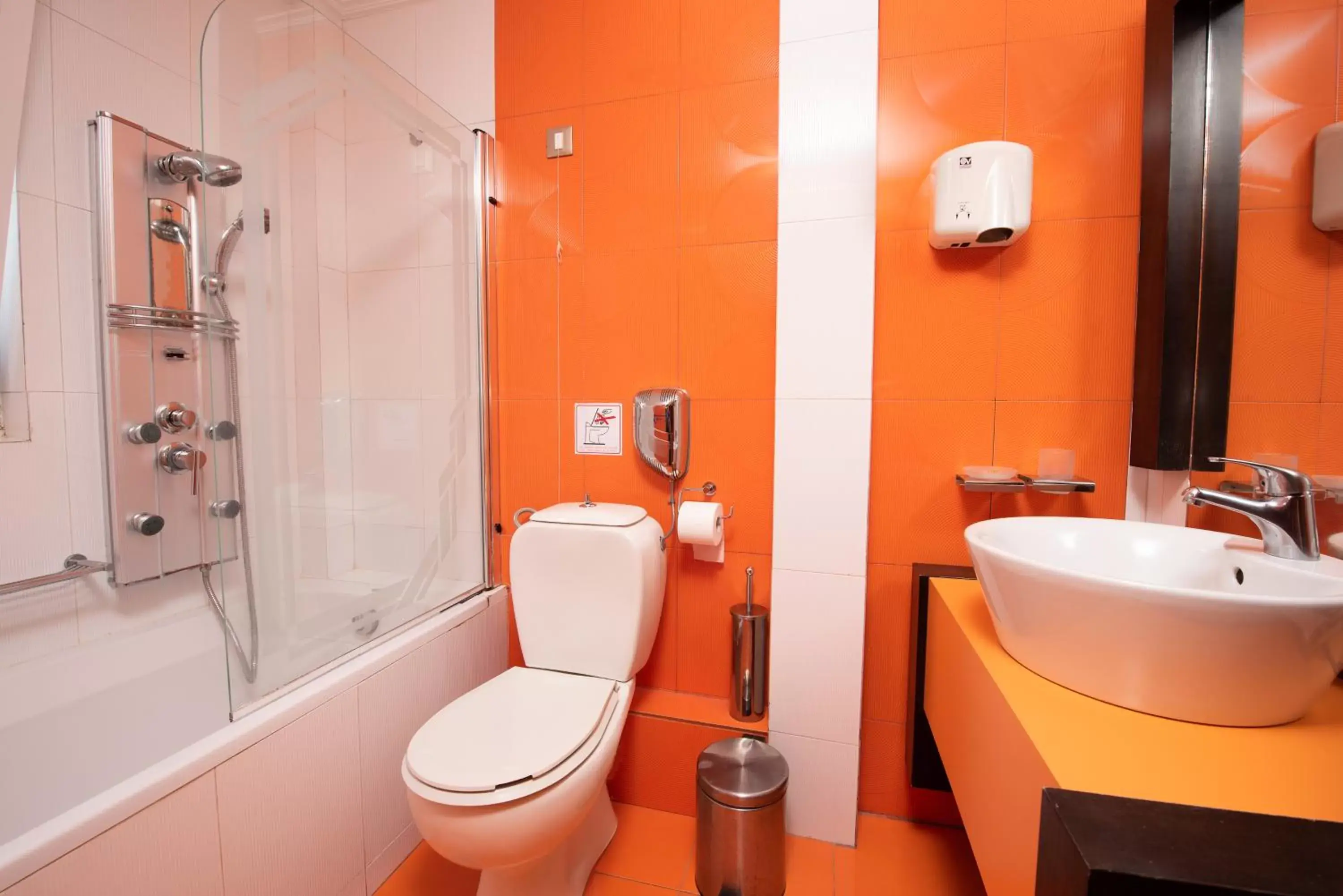 Toilet, Bathroom in Heliotrope Hotels