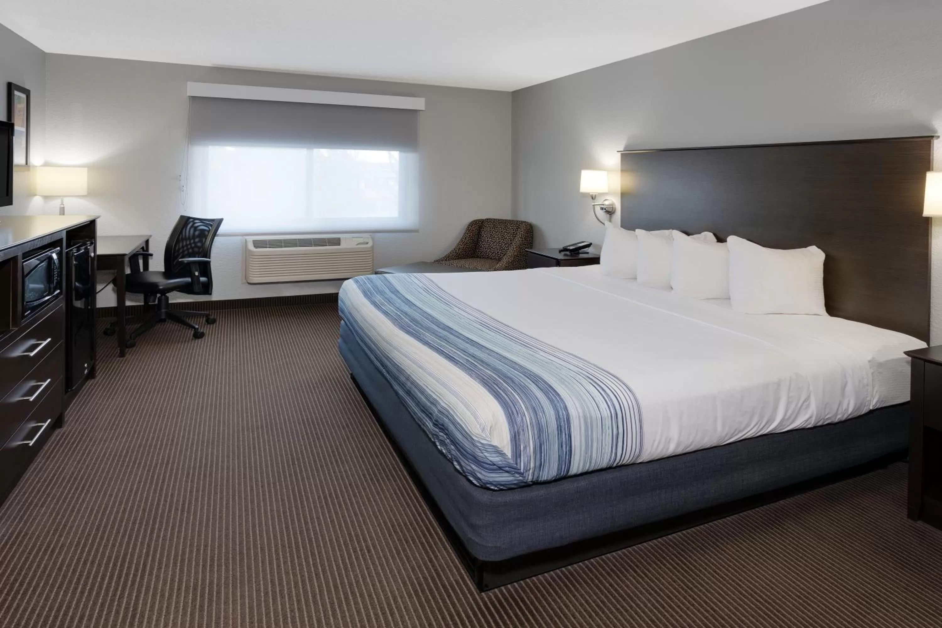 Guests, Bed in AmericInn by Wyndham Plover Stevens Point