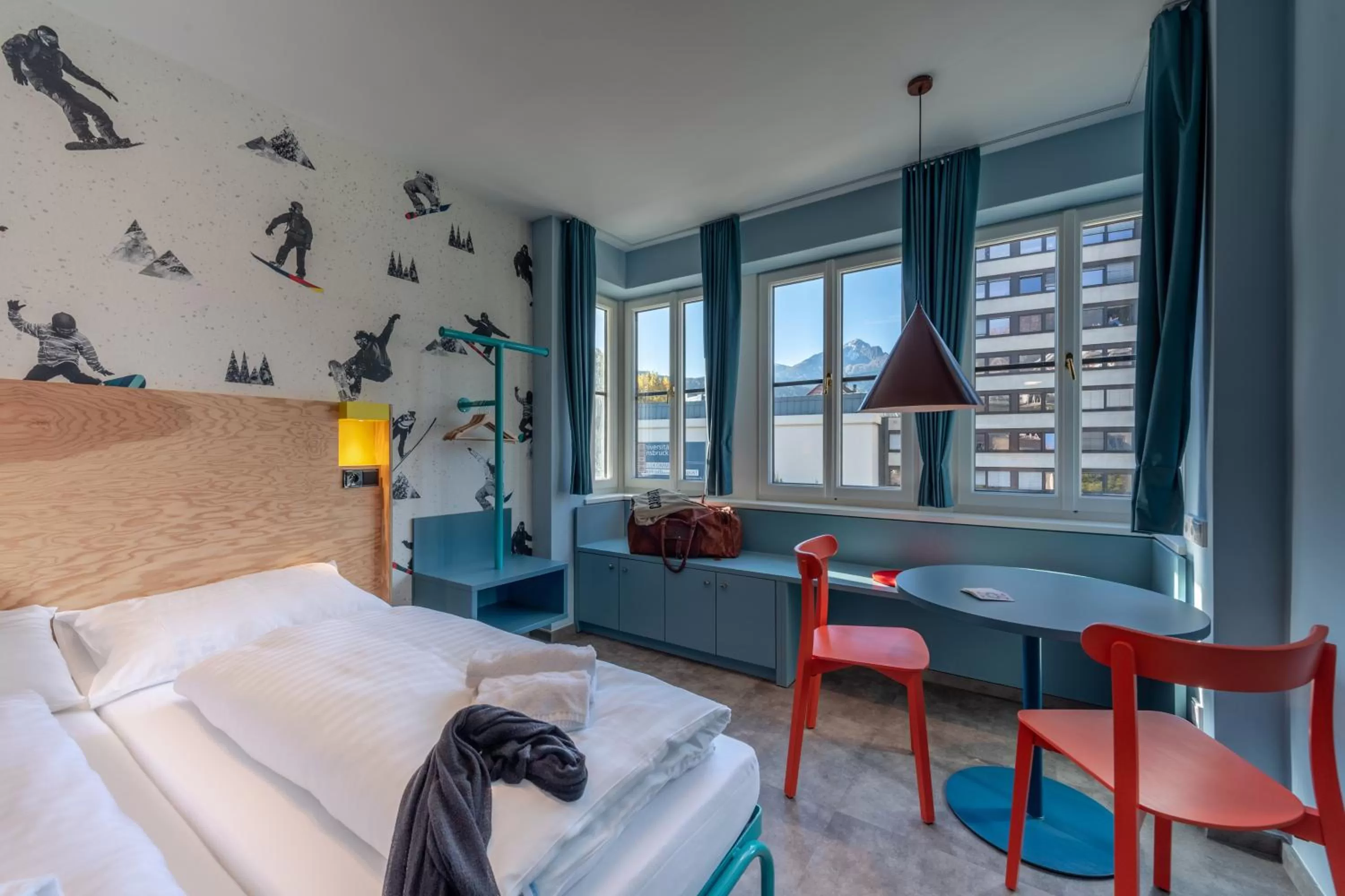 Photo of the whole room, Bed in MEININGER Hotel Innsbruck Zentrum