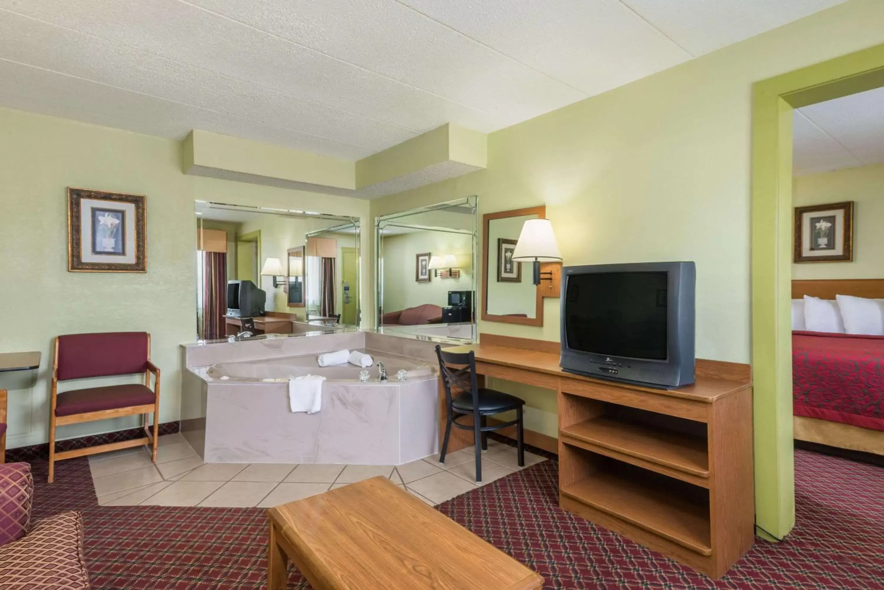 Photo of the whole room, TV/Entertainment Center in Days Inn & Suites by Wyndham Springfield on I-44