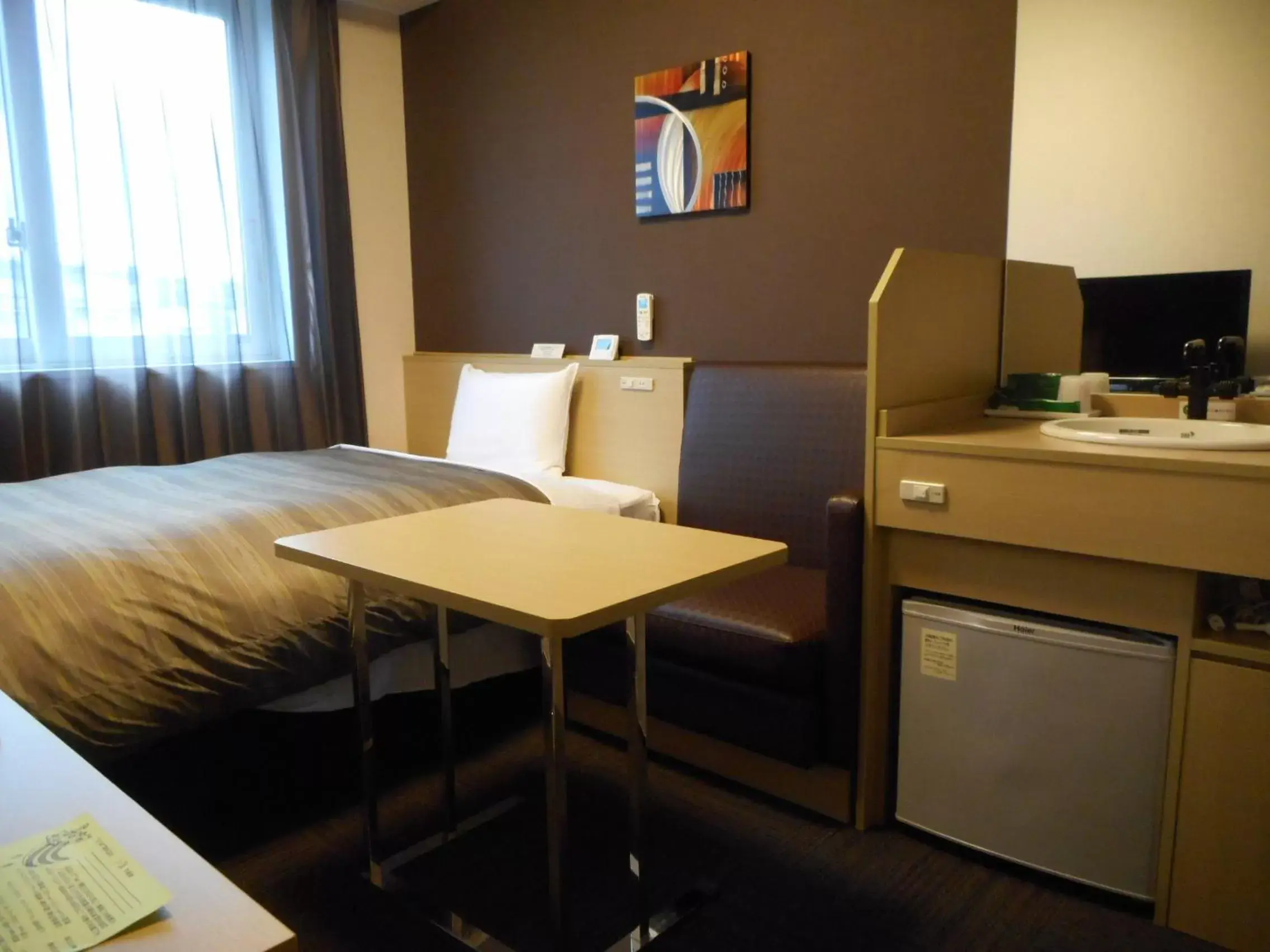 Photo of the whole room, Bed in Hotel Route-Inn Iwakiizumi Ekimae