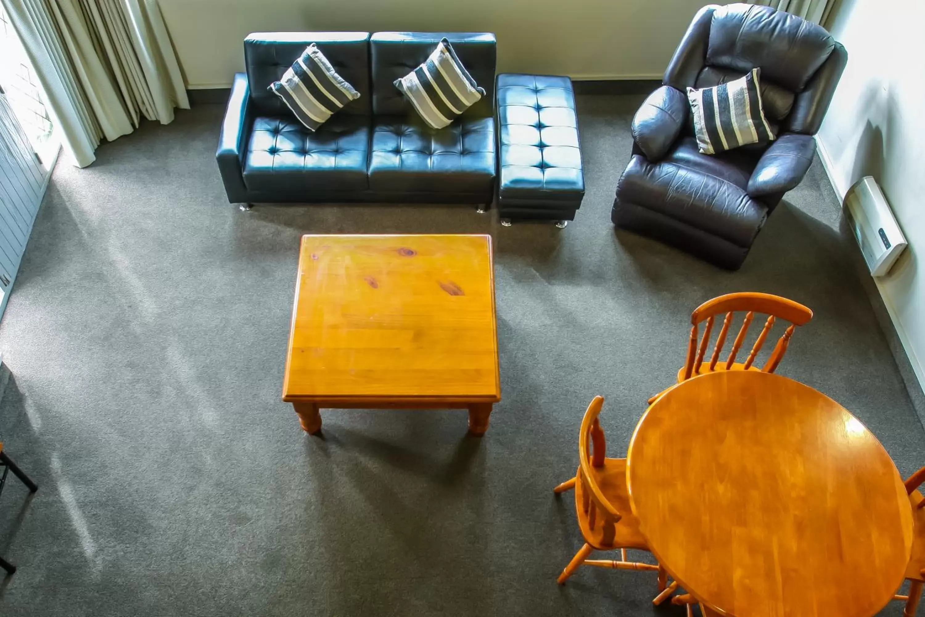 Living room, Seating Area in Camelot Motor Lodge