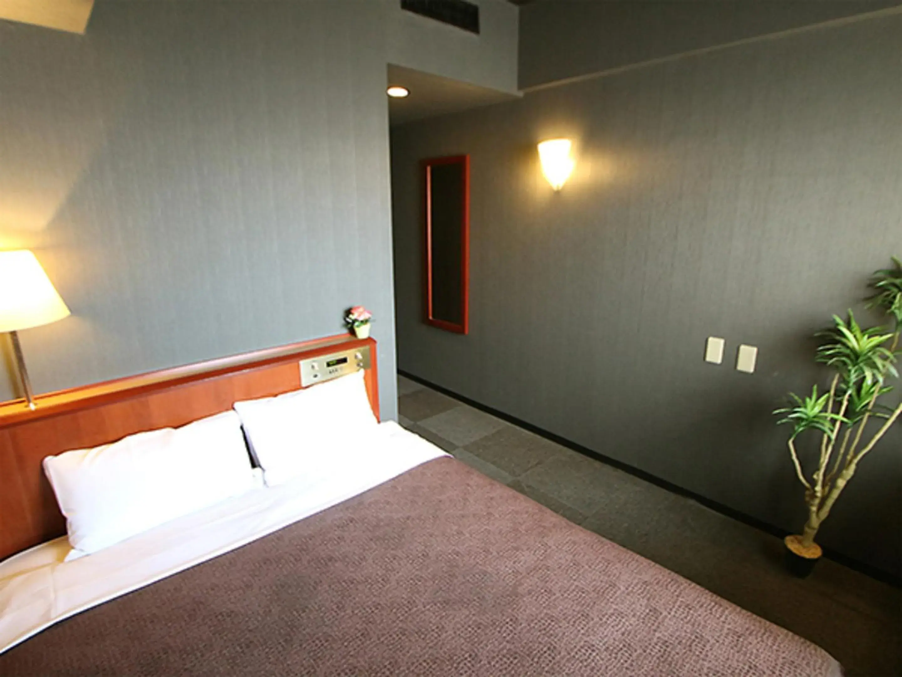 Bed in HOTEL LiVEMAX BUDGET Yokohama Tsurumi