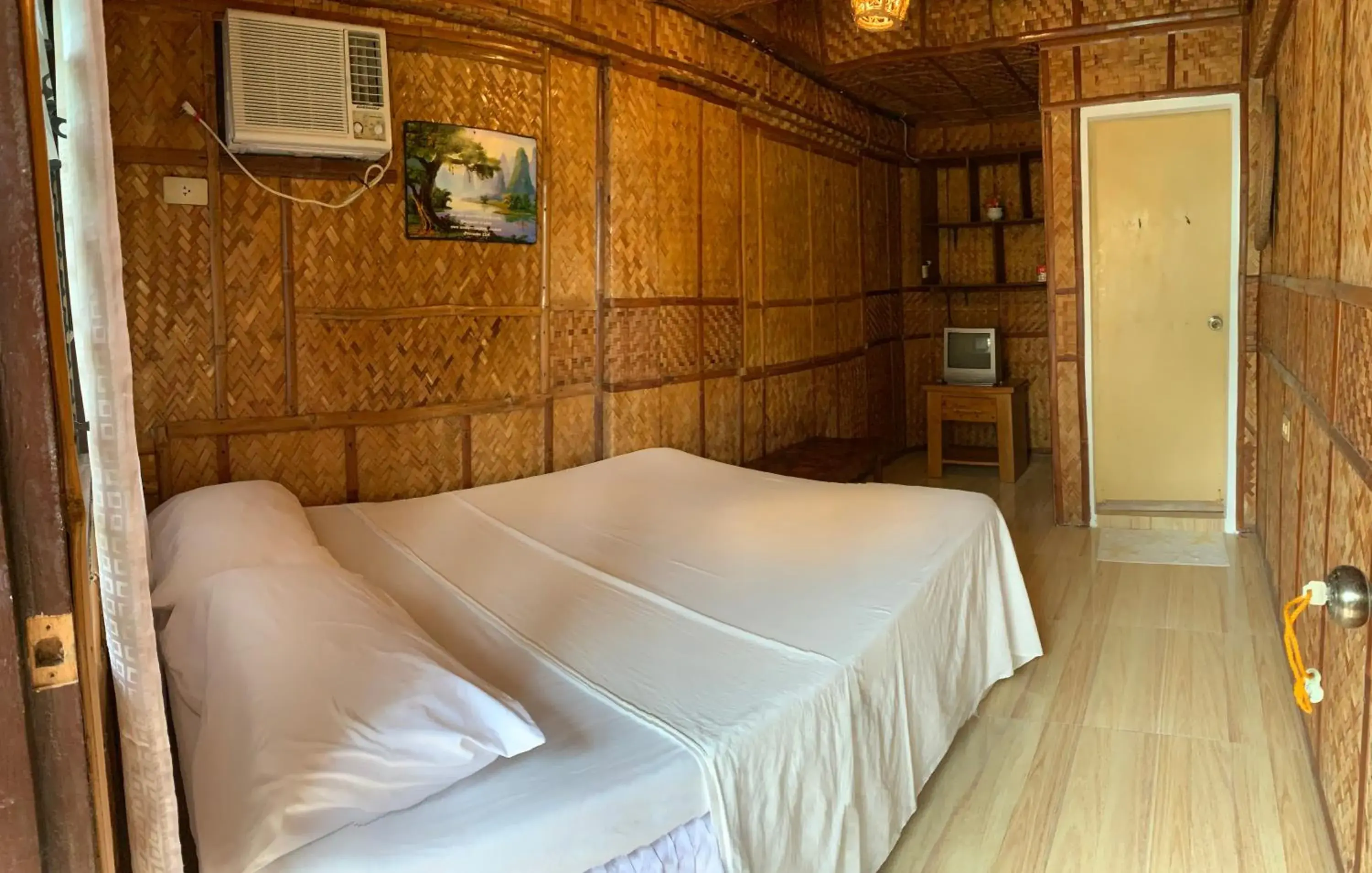 Bed in Bamboo House Beach Lodge & Restaurant