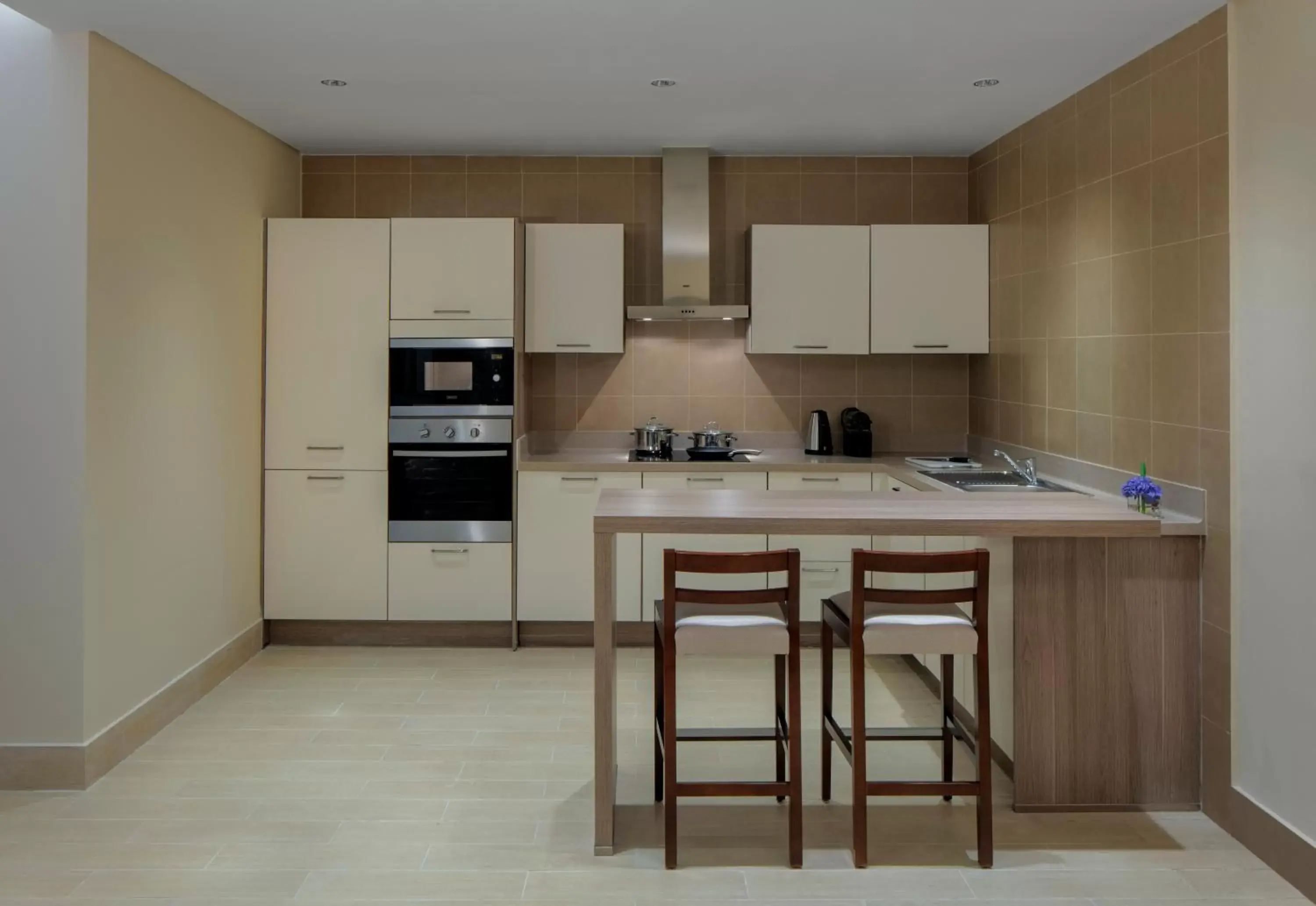 Kitchen or kitchenette, Kitchen/Kitchenette in Dusit Doha Hotel