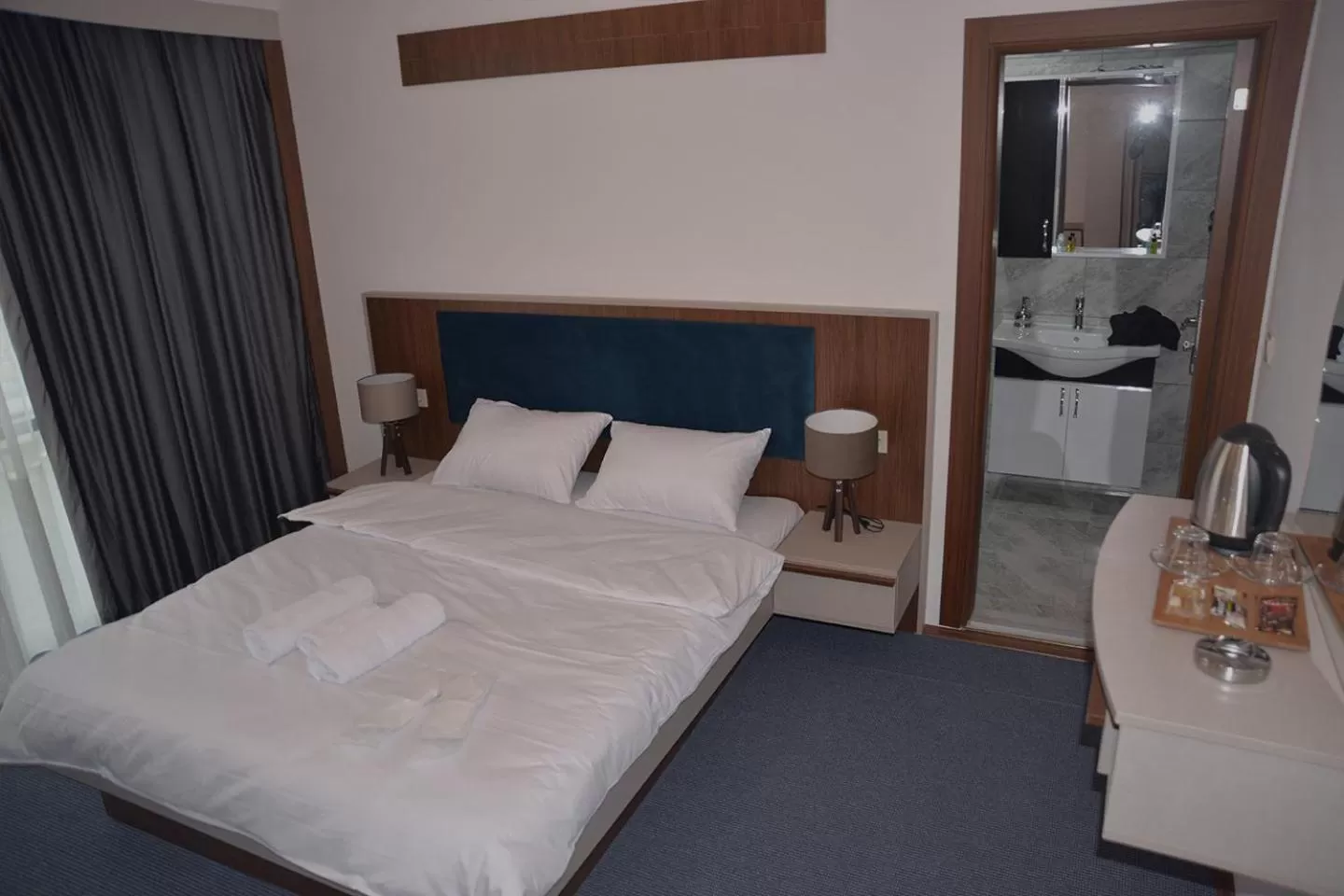 Bed in TEVETOGLU HOTEL