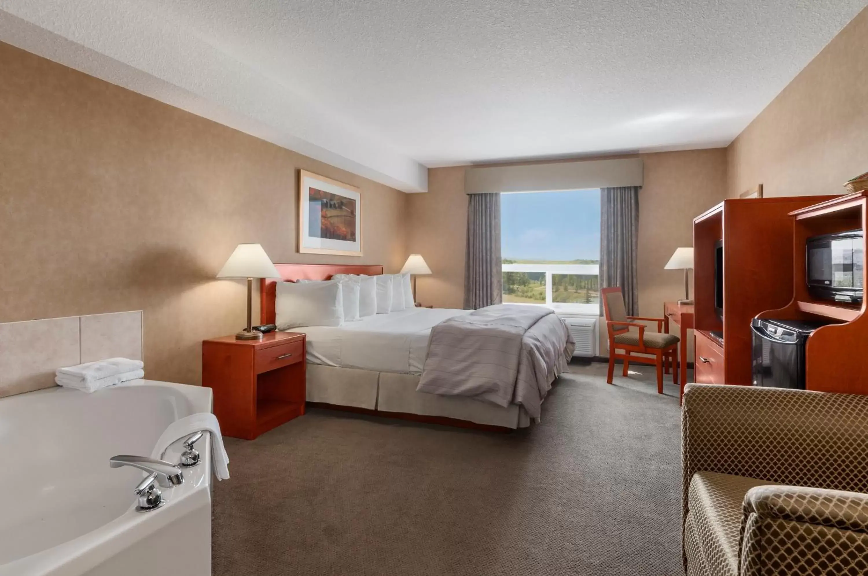 Bed in Days Inn & Suites by Wyndham Cochrane Bed in Days Inn & Suites by Wyndham Cochrane