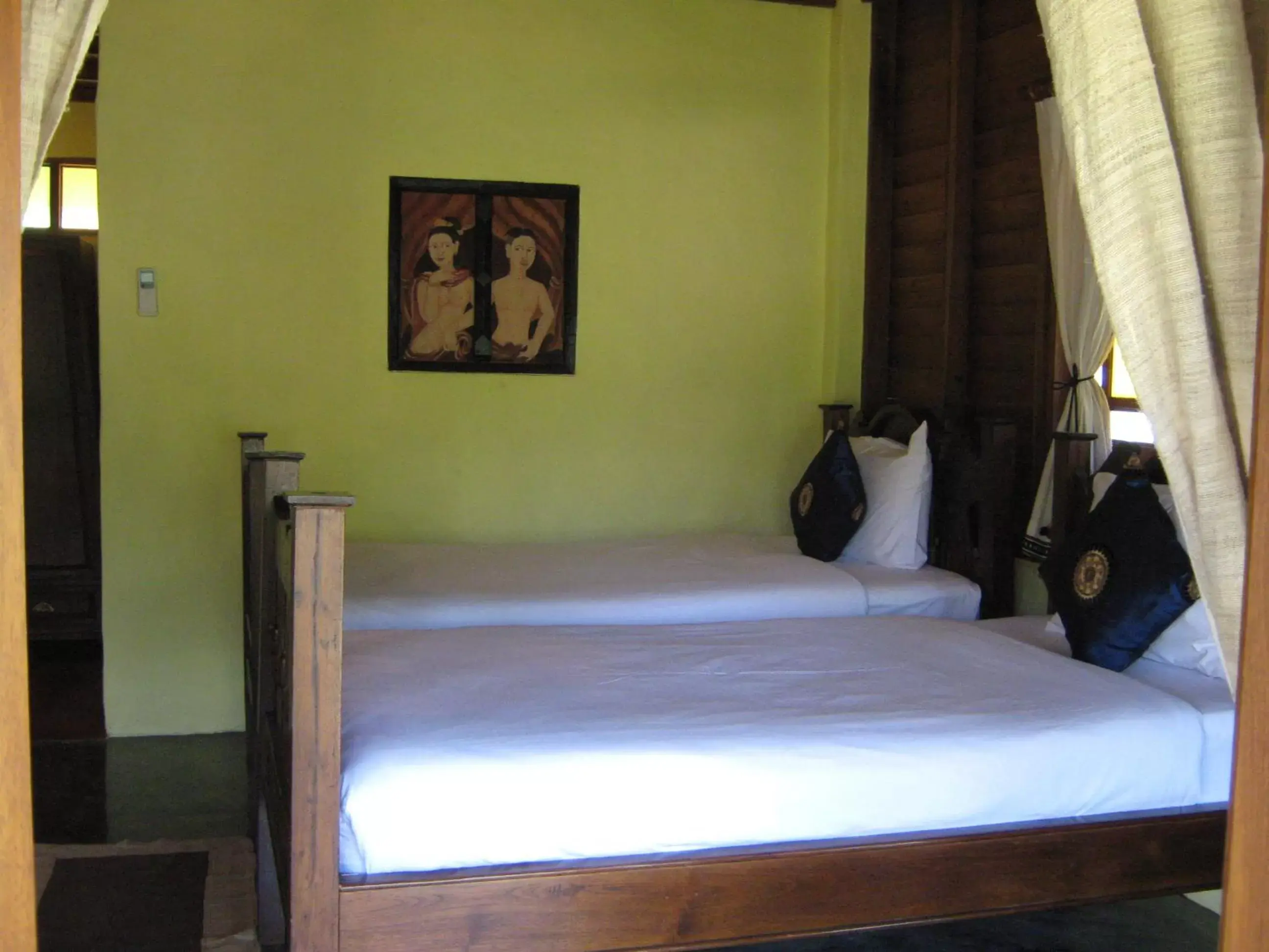 Bed in Pai Vimaan Resort