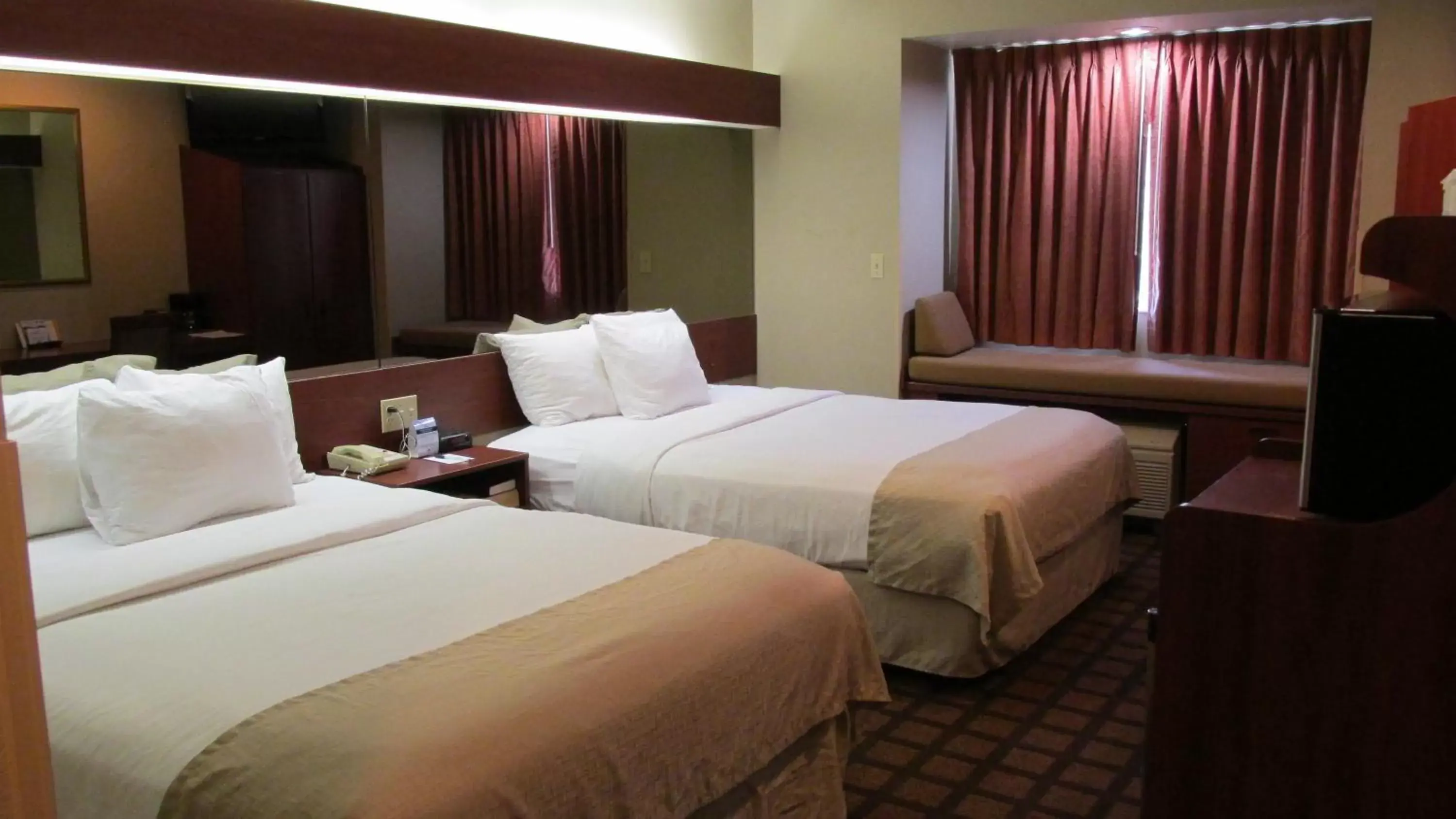Bed in Microtel Inn & Suites by Wyndham Rapid City