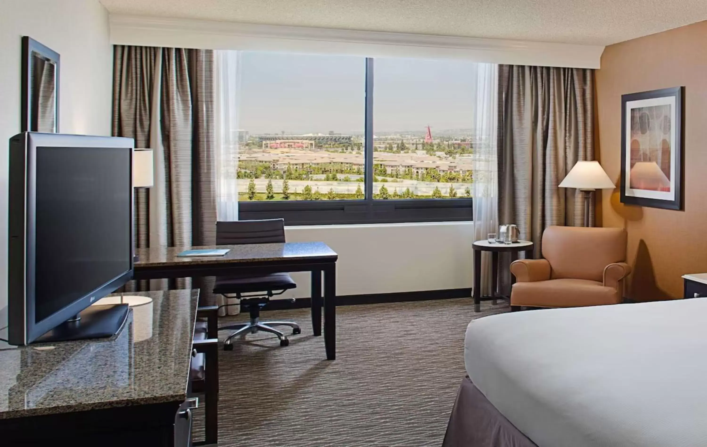 TV and multimedia, TV/Entertainment Center in Hotel Fera Anaheim, a DoubleTree by Hilton Hotel