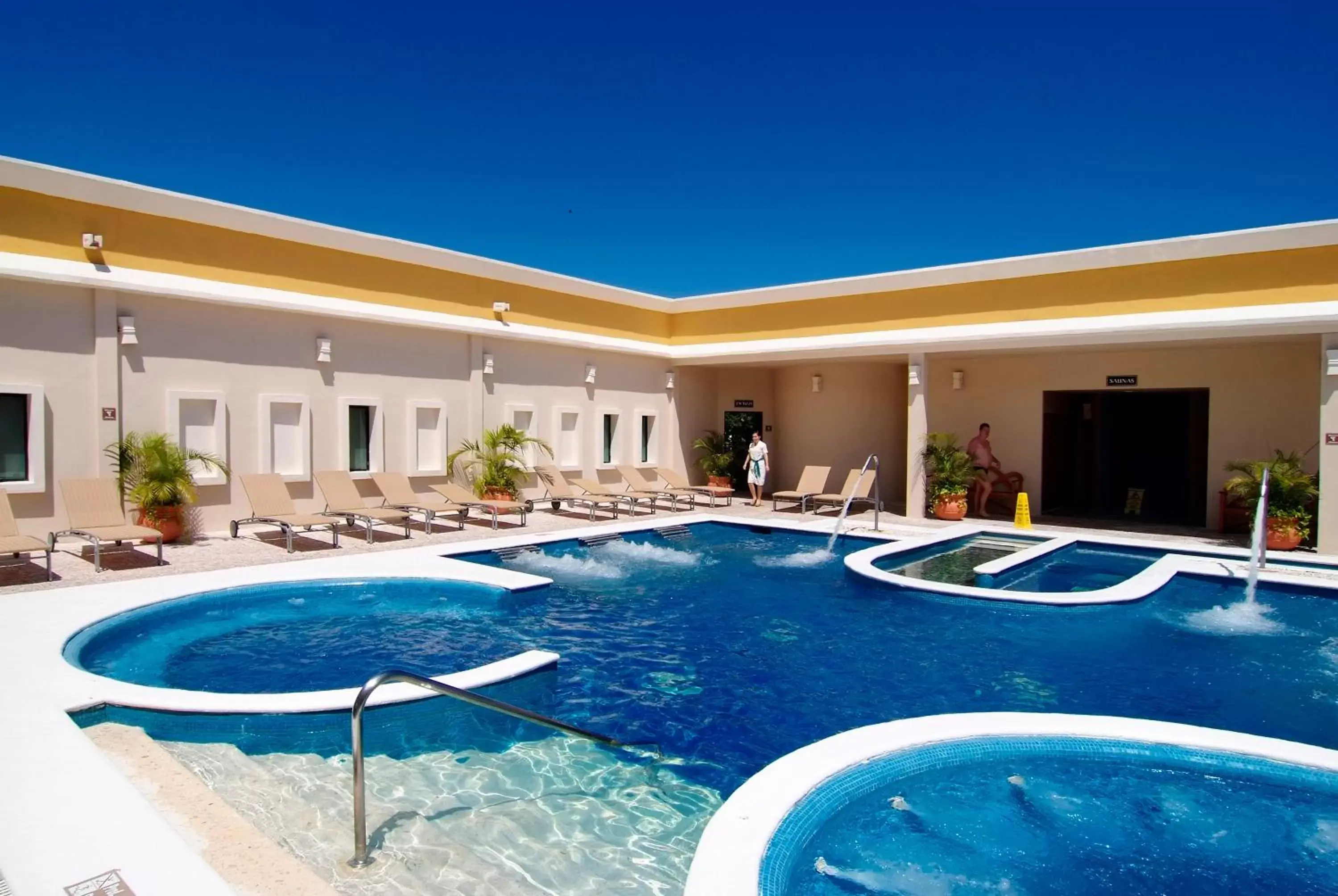 Swimming pool, Property Building in Sandos Caracol Eco Resort All Inclusive