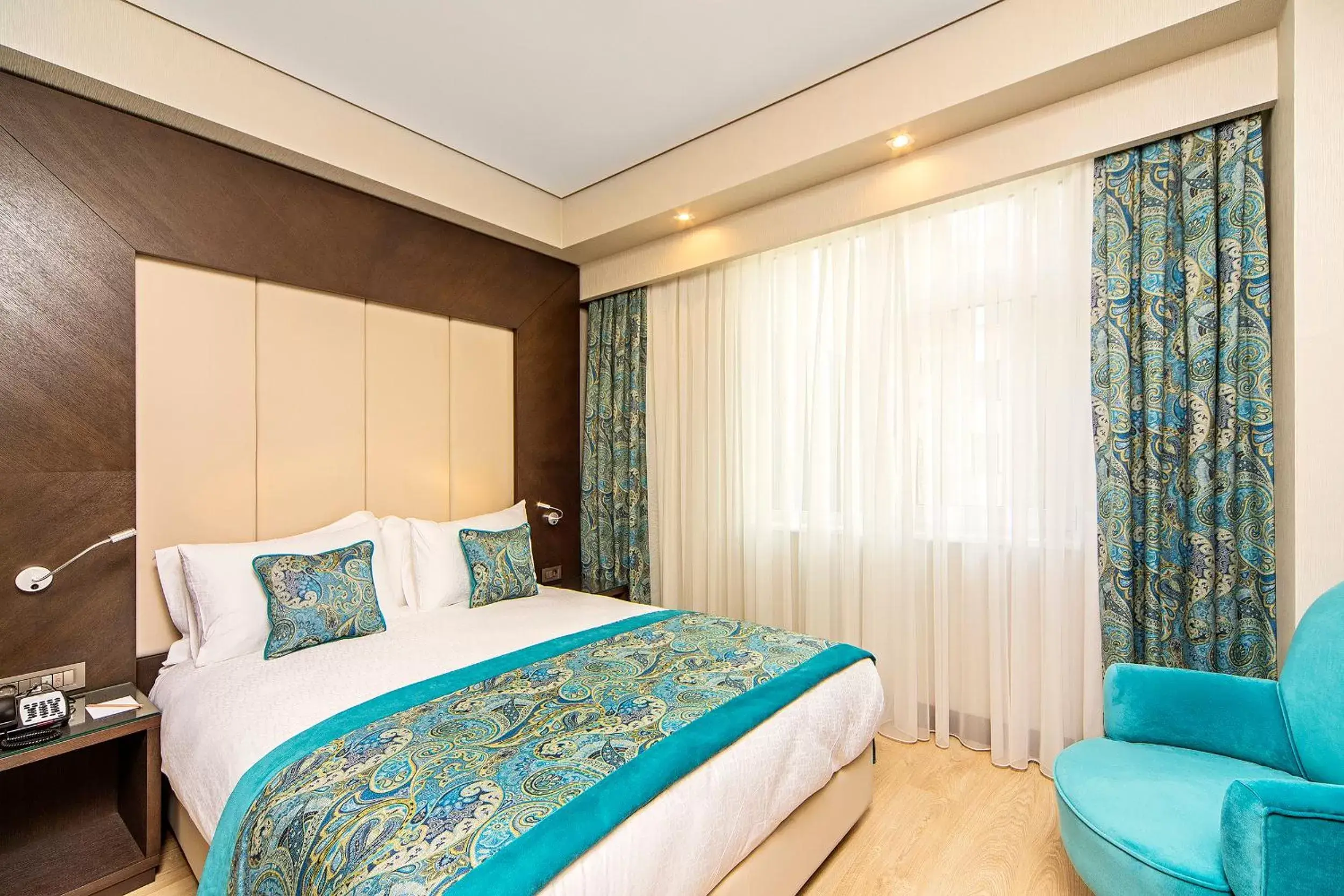 Bed in Mukarnas Taksim Hotel
