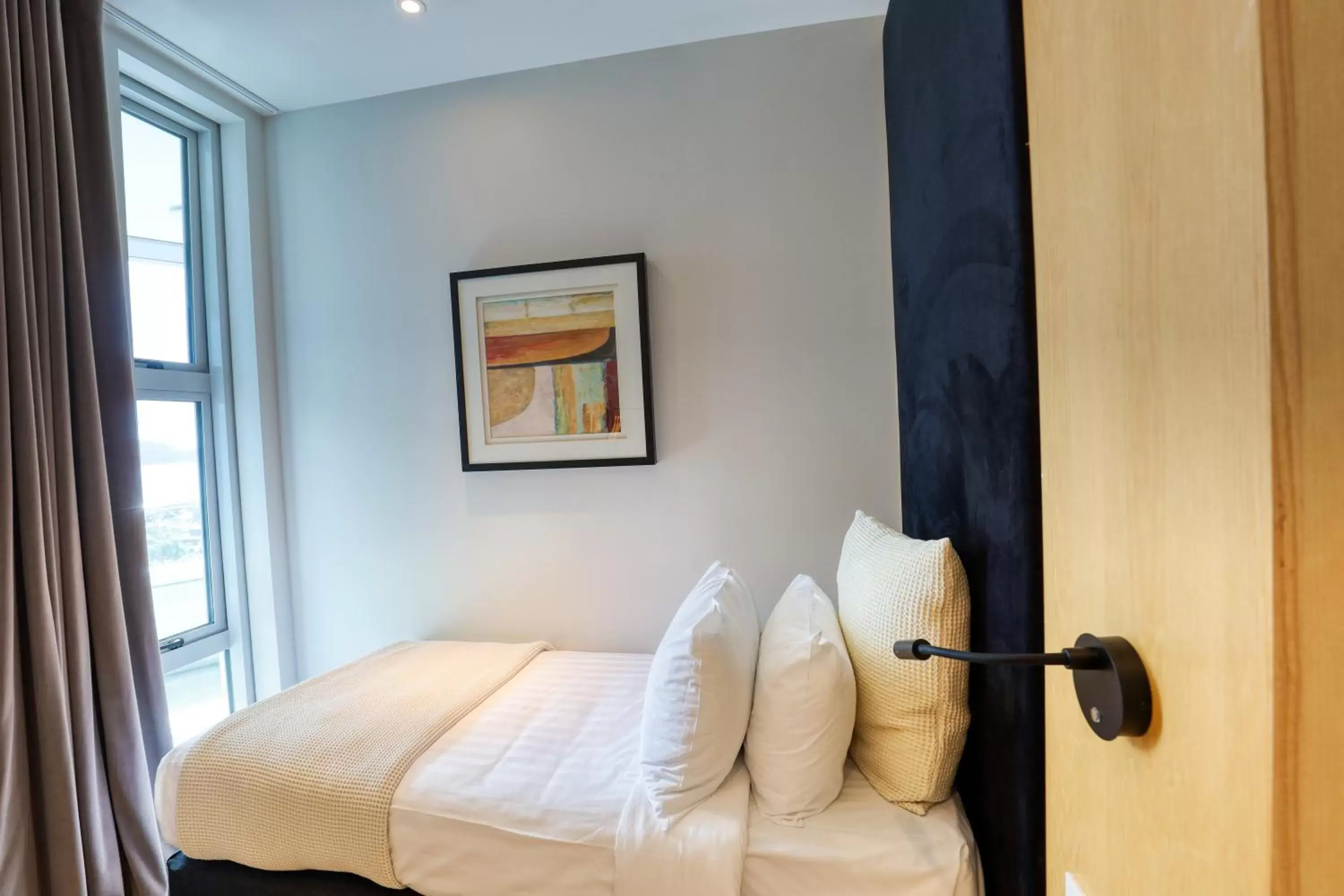 Bedroom, Bed in Ramada Suites by Wyndham Nautilus Orewa