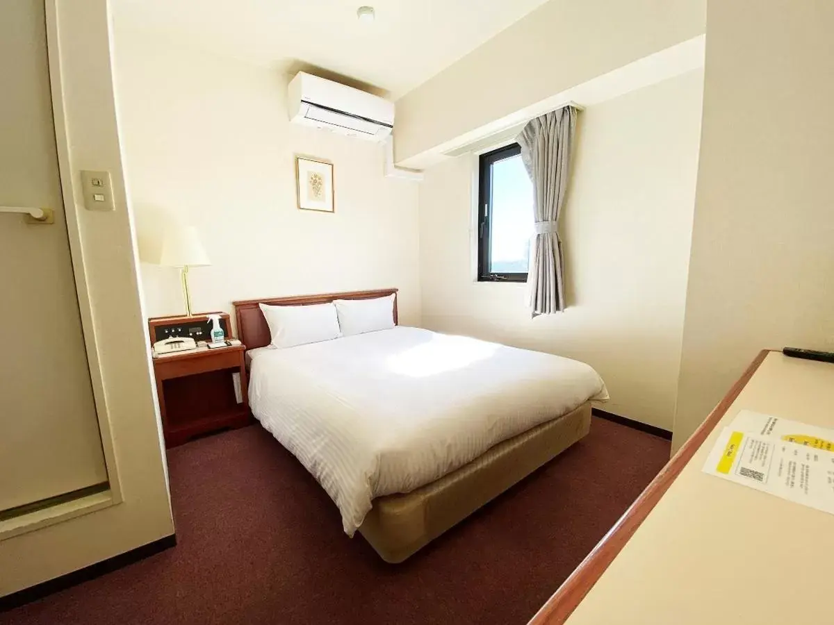 Bed in Smile Hotel Kitaasaka