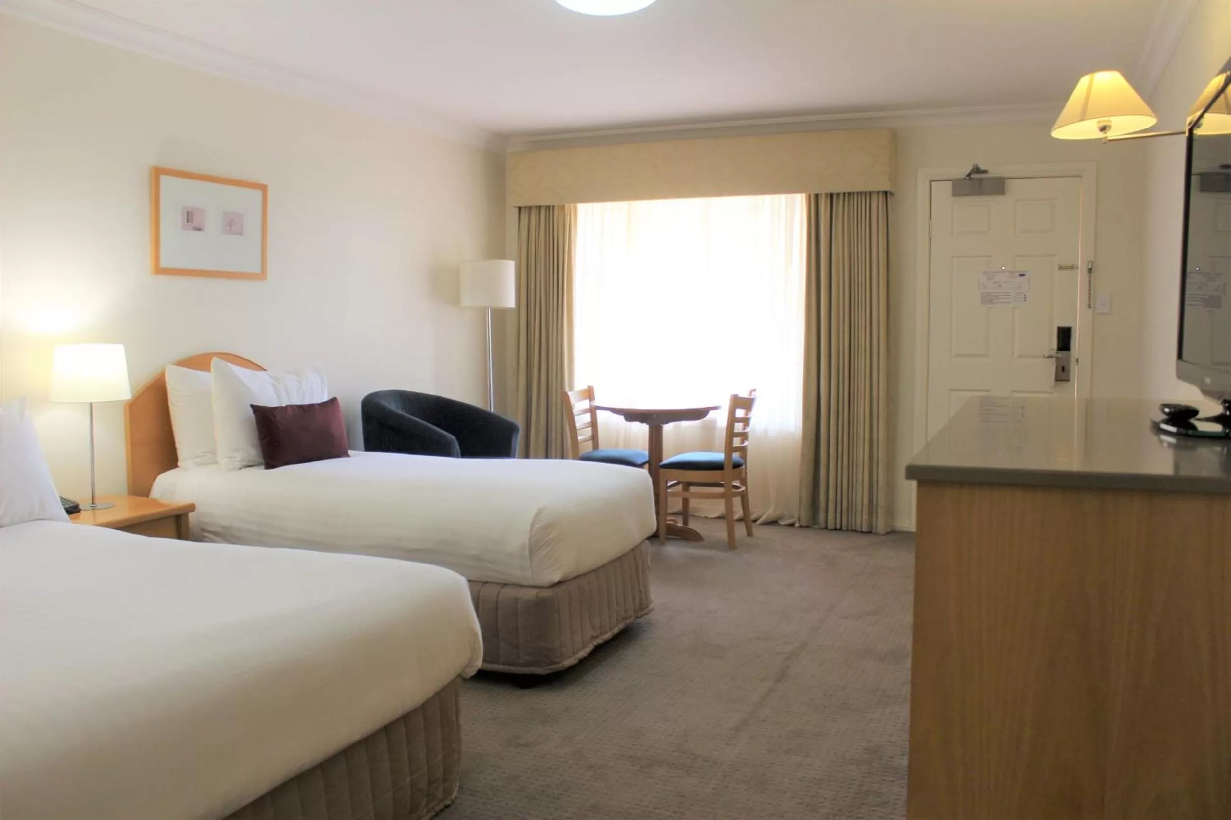 Bed in Carlyle Suites & Apartments