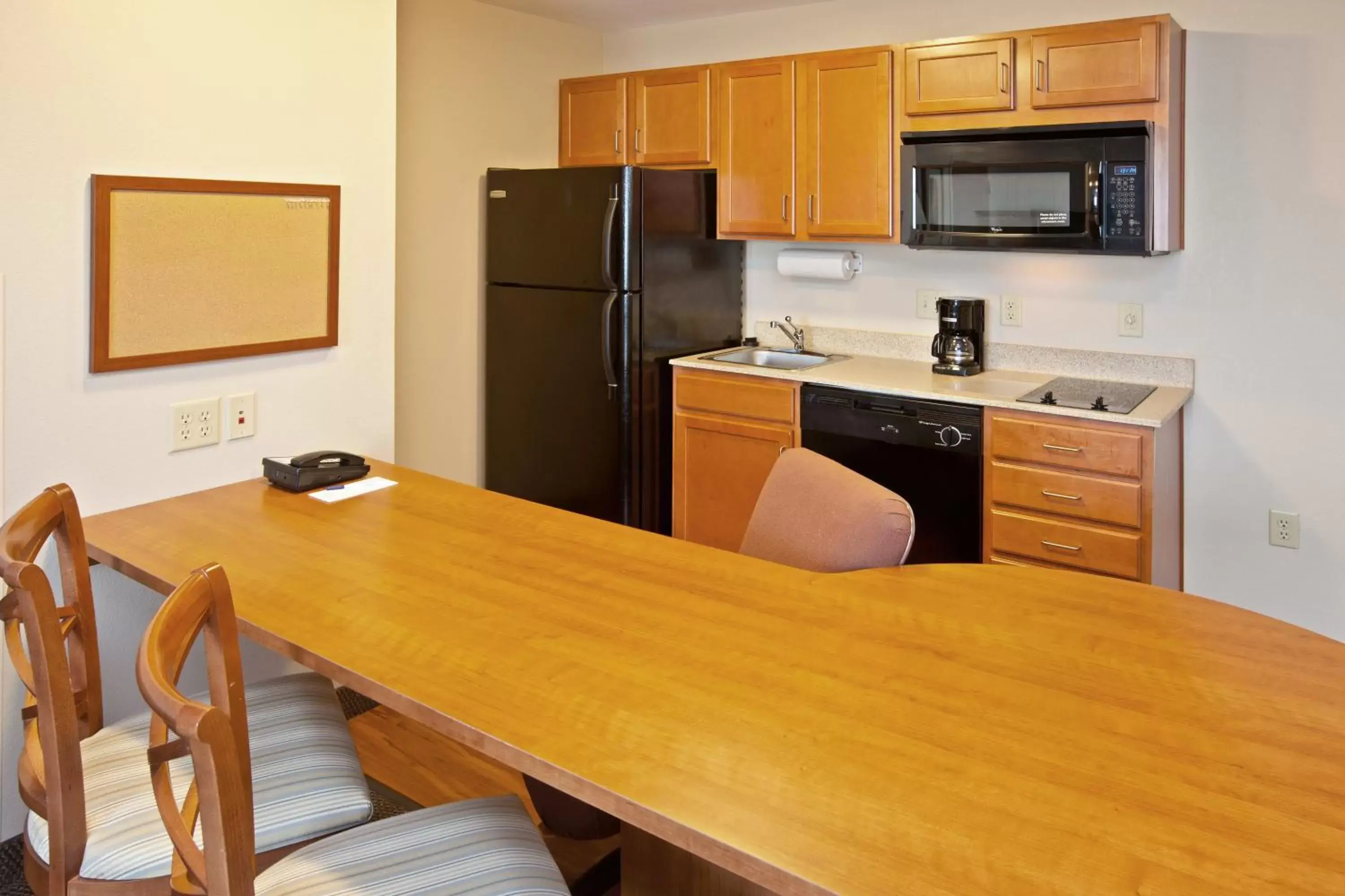 Photo of the whole room, Kitchen/Kitchenette in Candlewood Suites Louisville North, an IHG Hotel