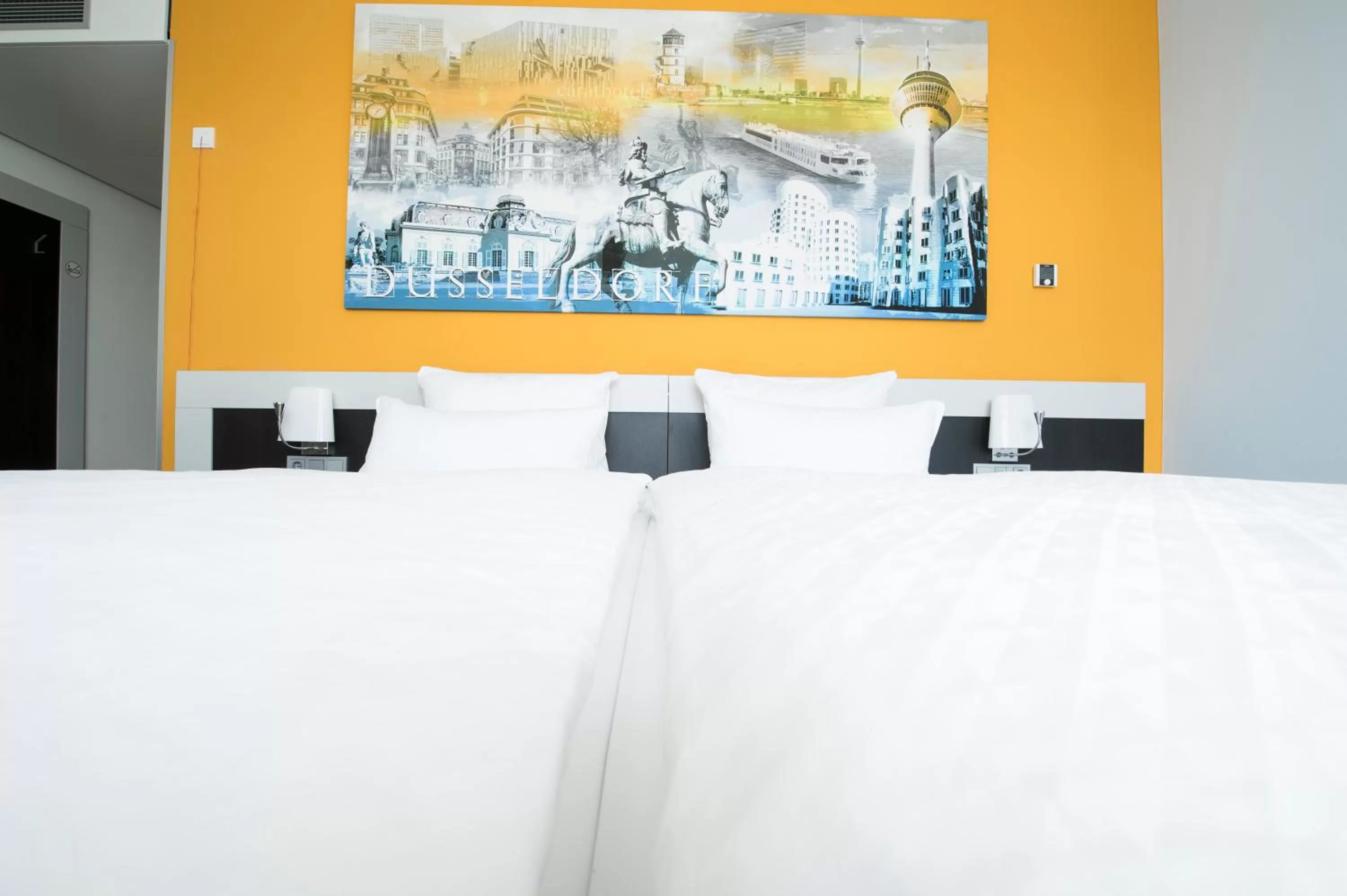 Bed in Carathotel Düsseldorf City