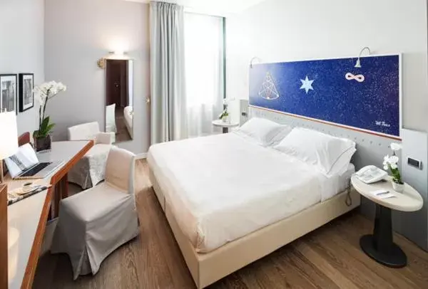 Bed in Cosmo Hotel Torri Bed in Cosmo Hotel Torri