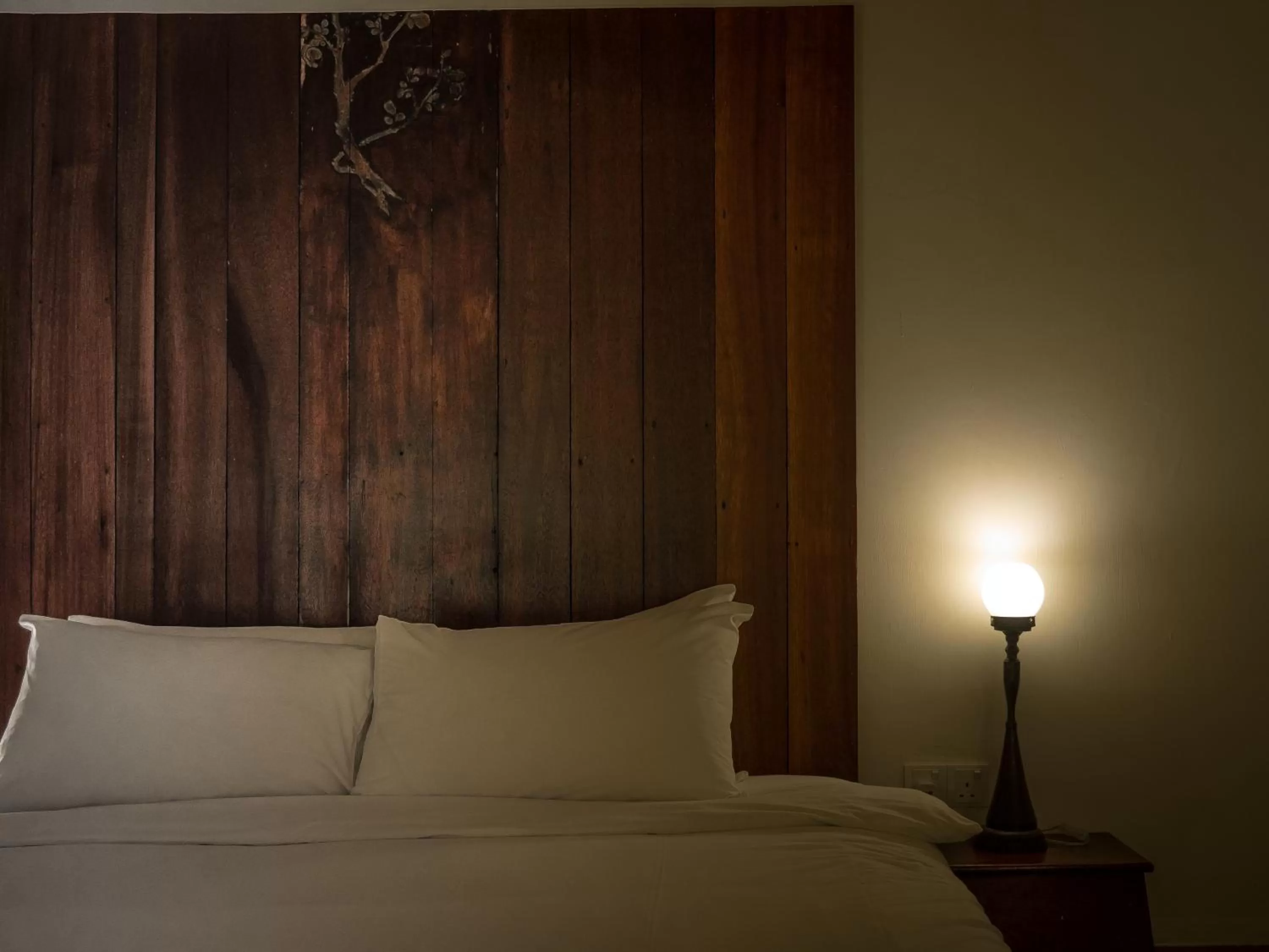 Bed in Ren I Tang Heritage Inn