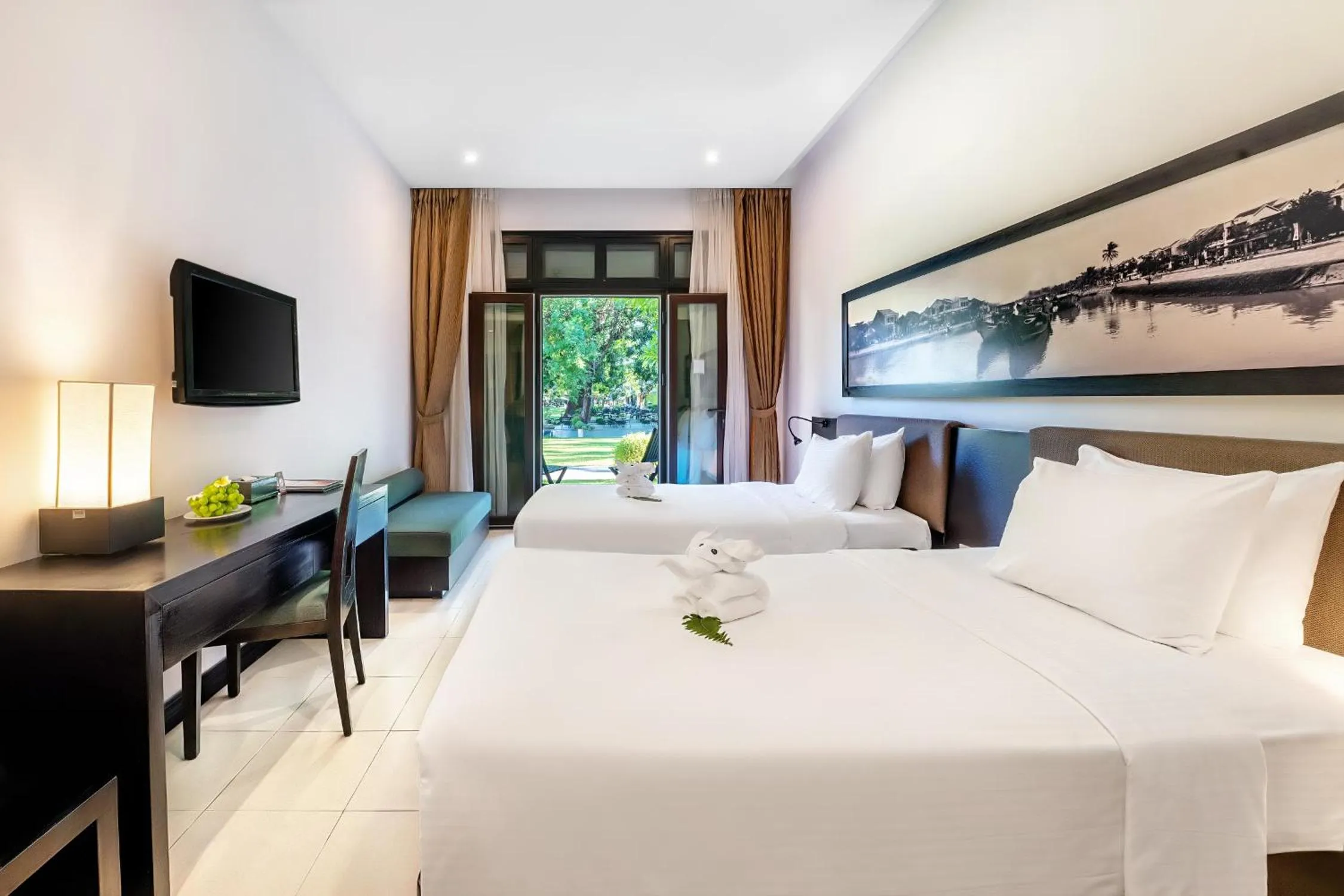 Bed in HOI AN HISTORIC HOTEL